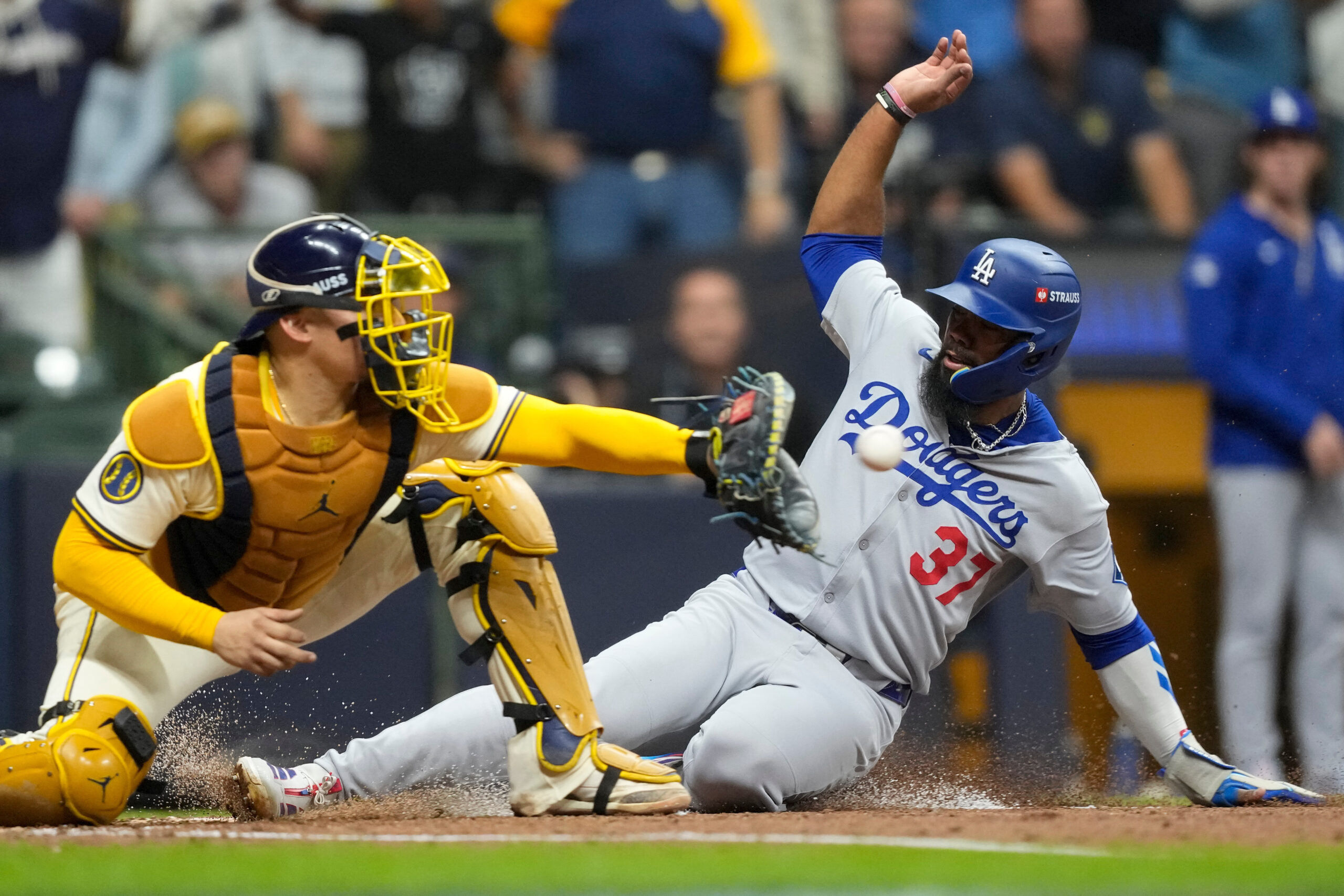 The Dodgers’ Teoscar Hernández is forced out at home by...