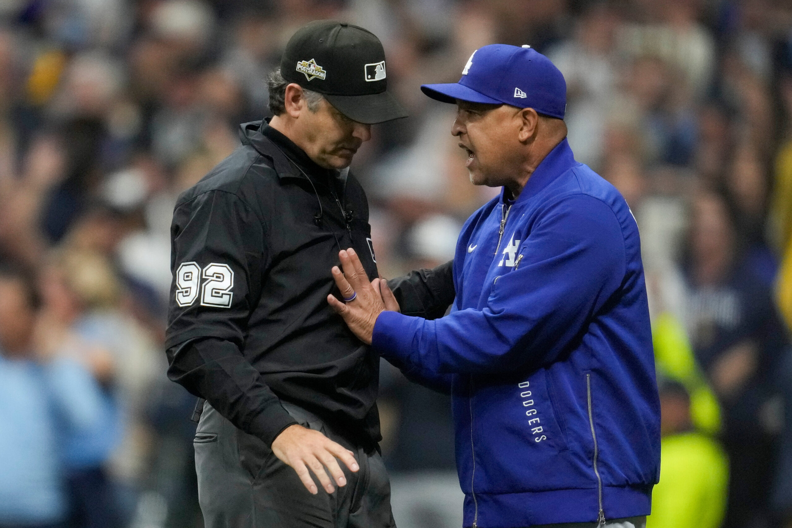 Dodgers manager Dave Roberts argues with umpire James Hoys during...