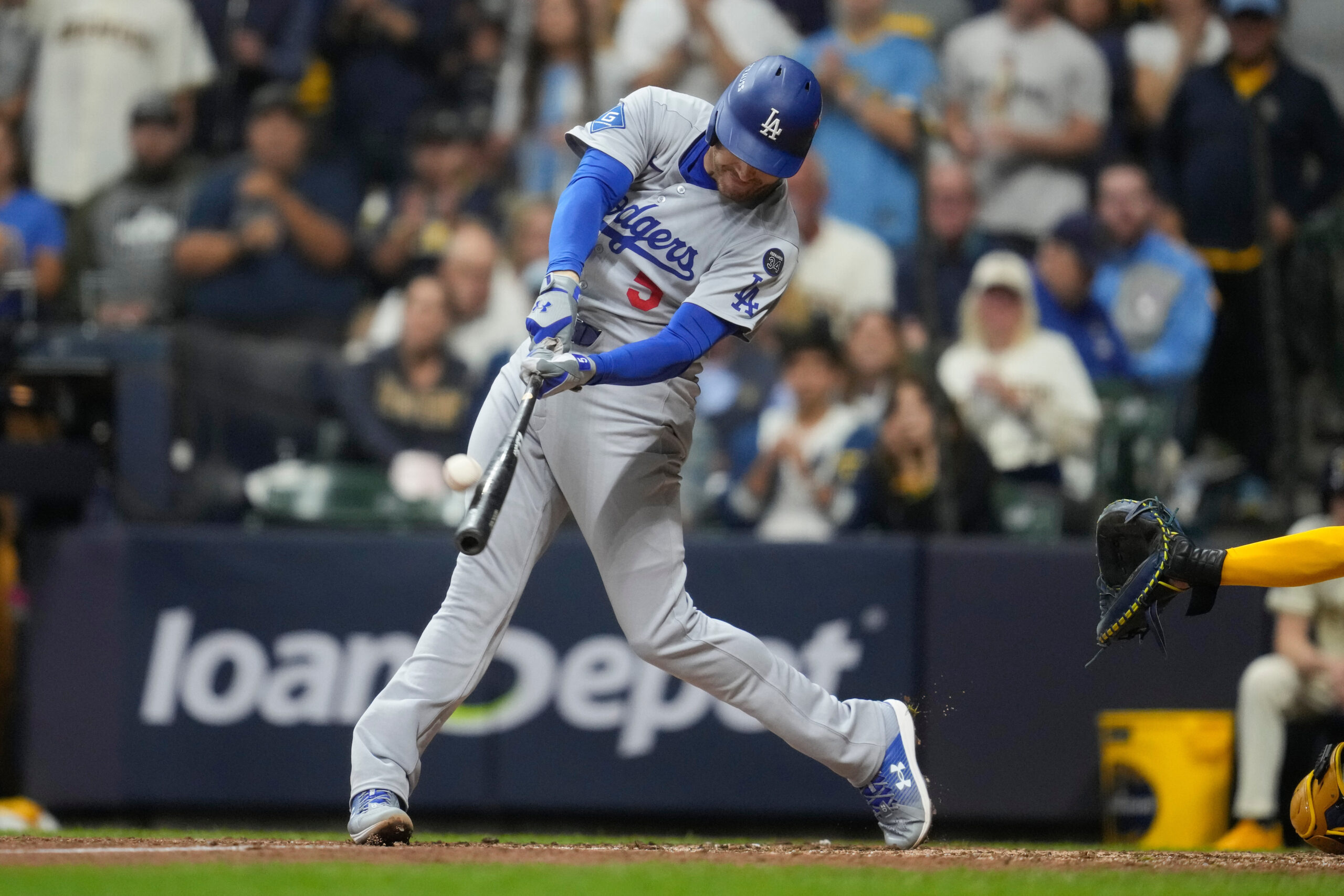 The Dodgers’ Freddie Freeman hits a solo home run during...