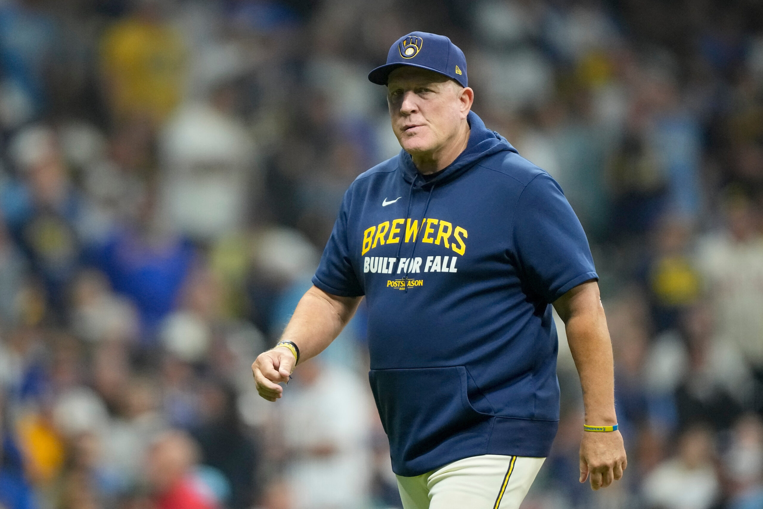 Milwaukee Brewers manager Pat Murphy walks back from the mound...
