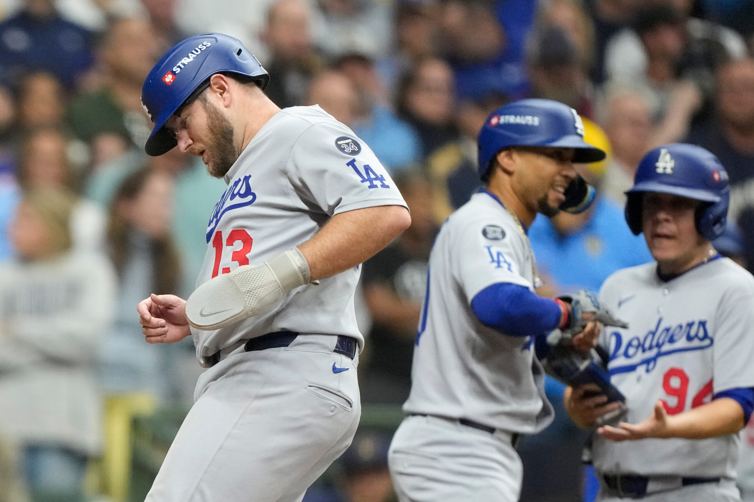 The Dodgers’ Max Muncy scores on a bases-loaded walk against...