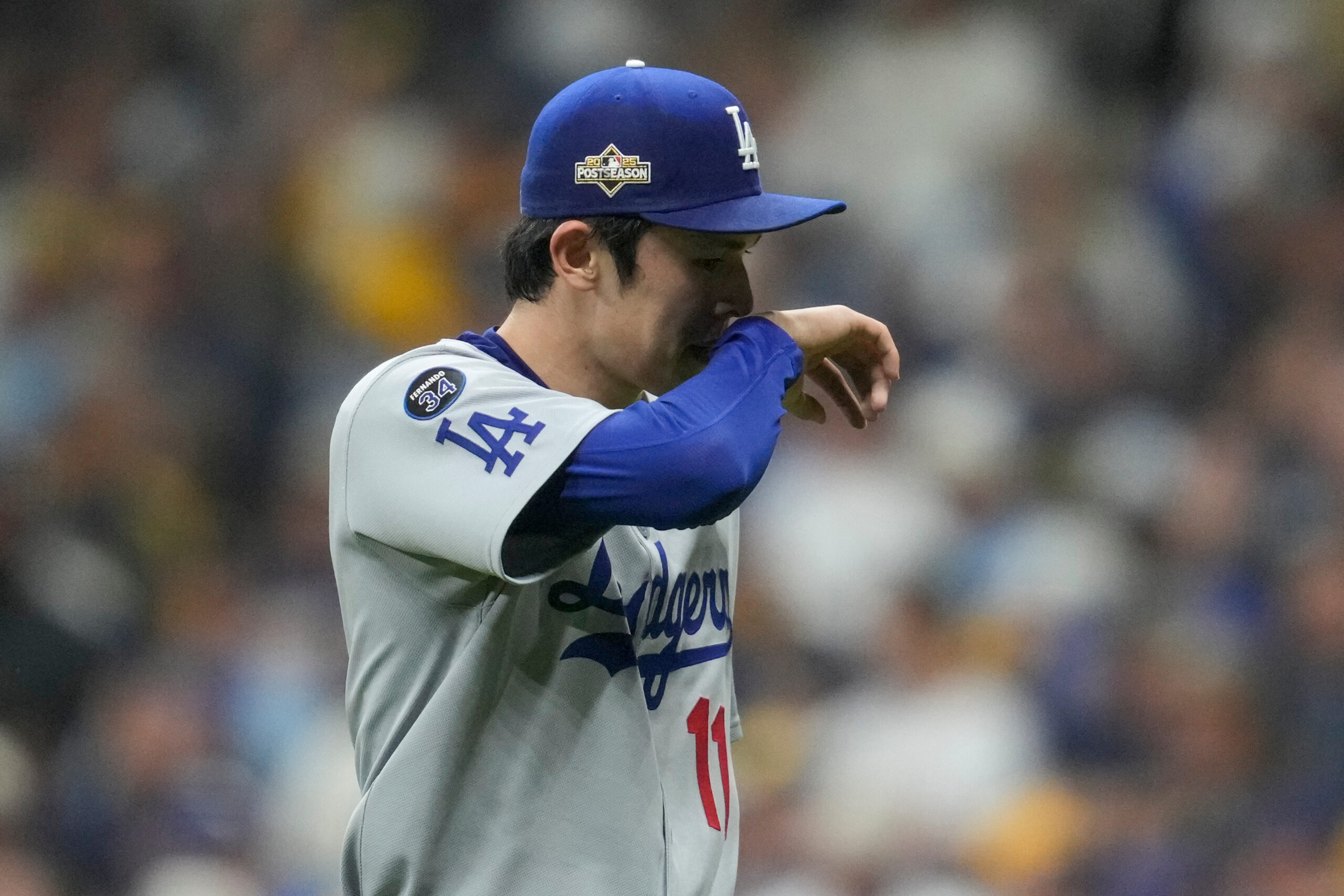 Dodgers relief pitcher Roki Sasaki is taken out of the...
