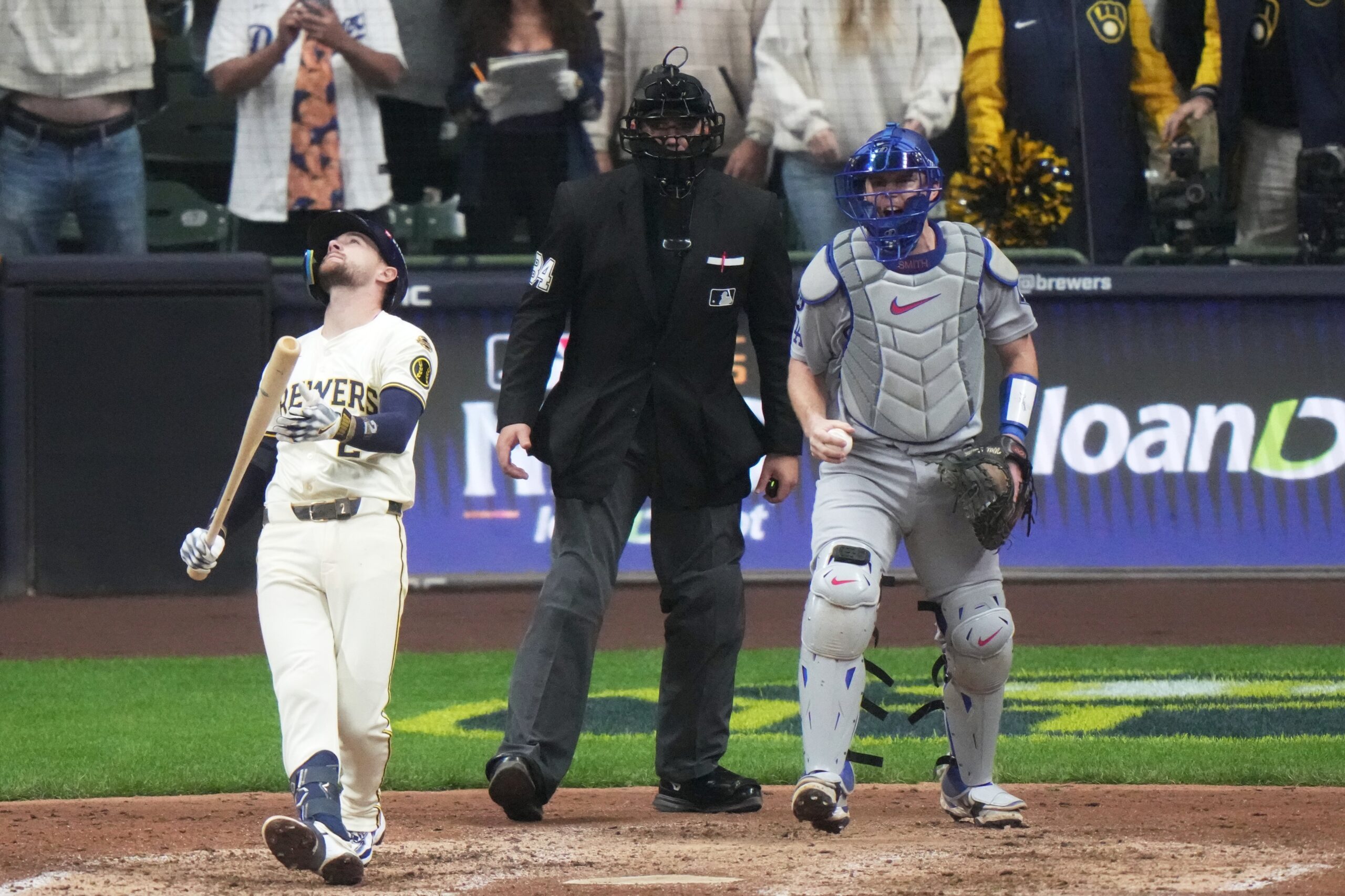 The Milwaukee Brewers’ Brice Turang reacts after striking out with...