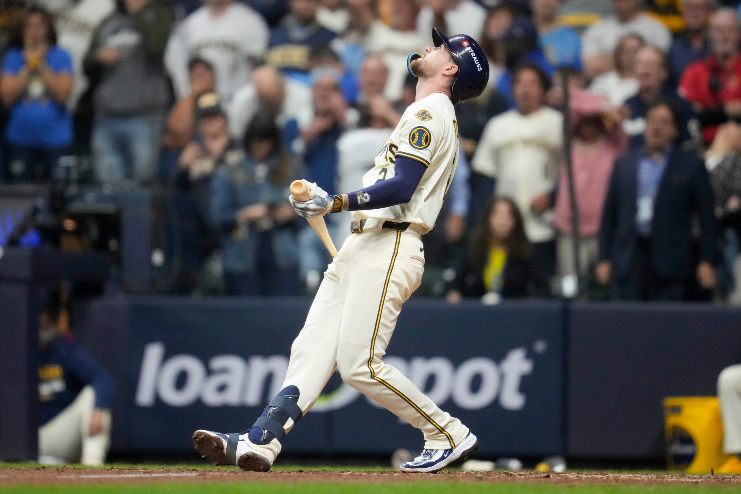 The Milwaukee Brewers’ Brice Turang reacts after striking out with...
