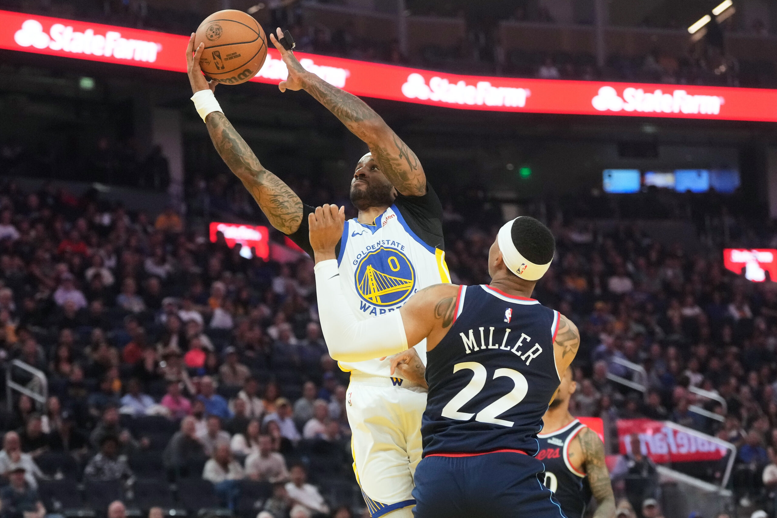 Golden State Warriors guard Gary Payton II, left, shoots in...