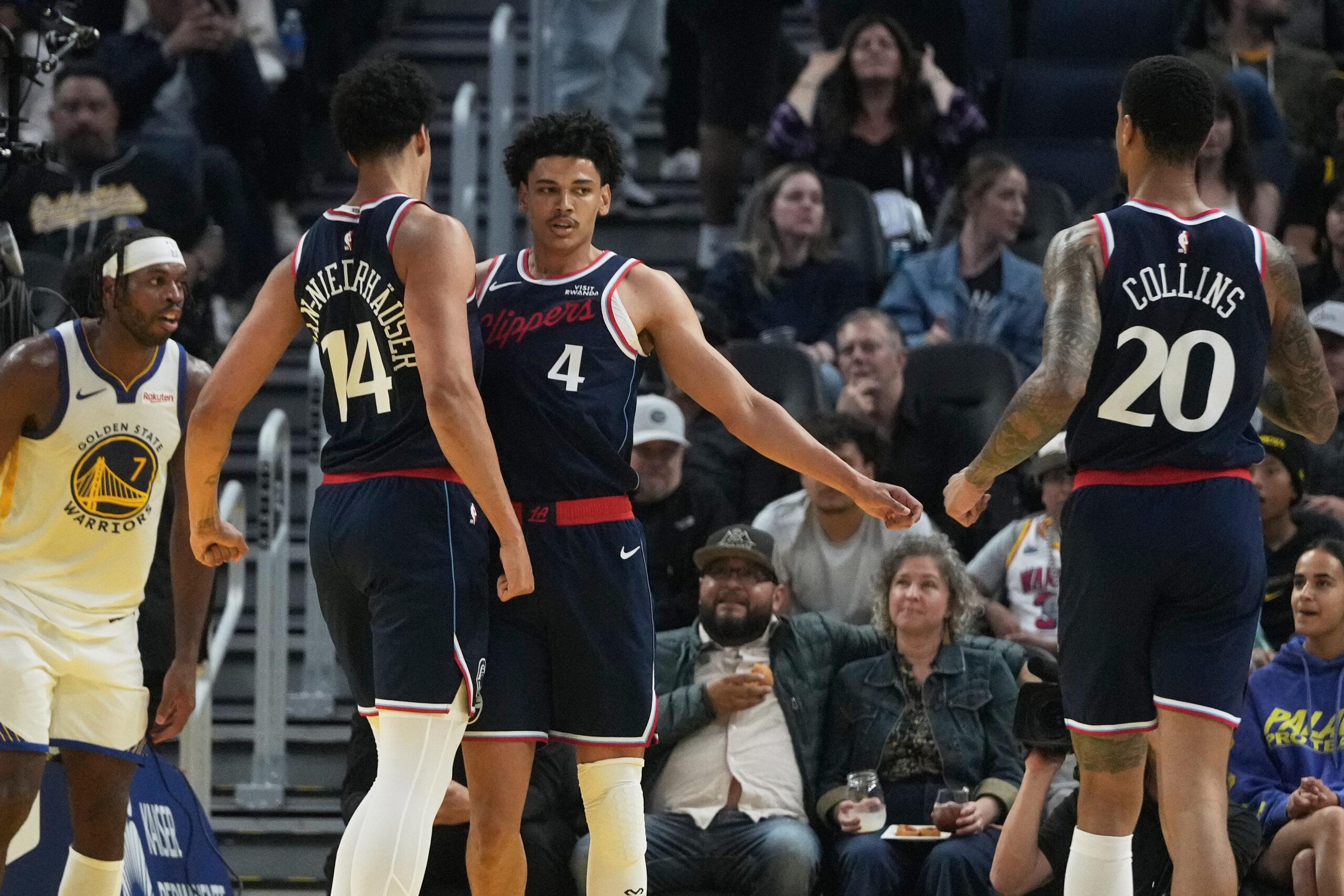 Clippers guard Kobe Sanders (4) is congratulated by center Yanic...