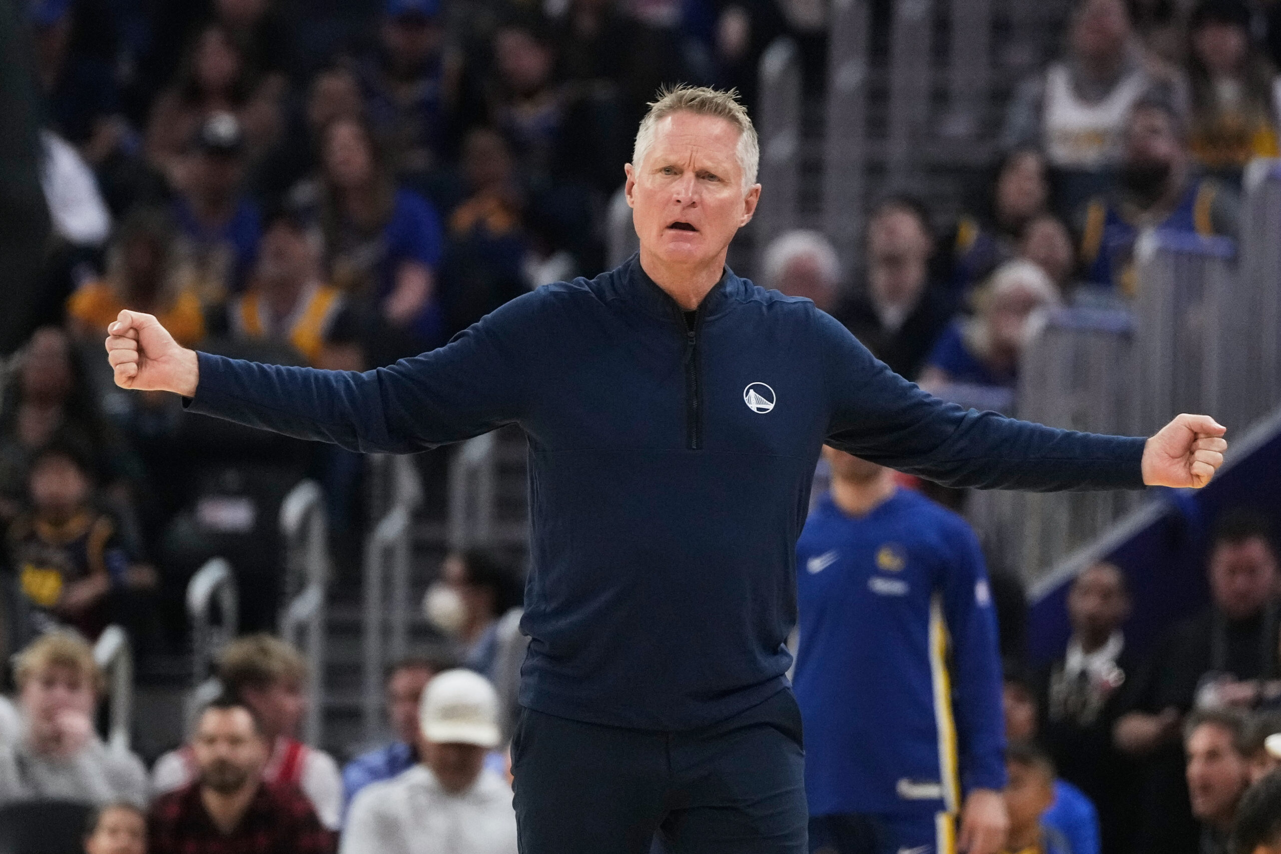 Golden State Warriors head coach Steve Kerr gestures toward officials...