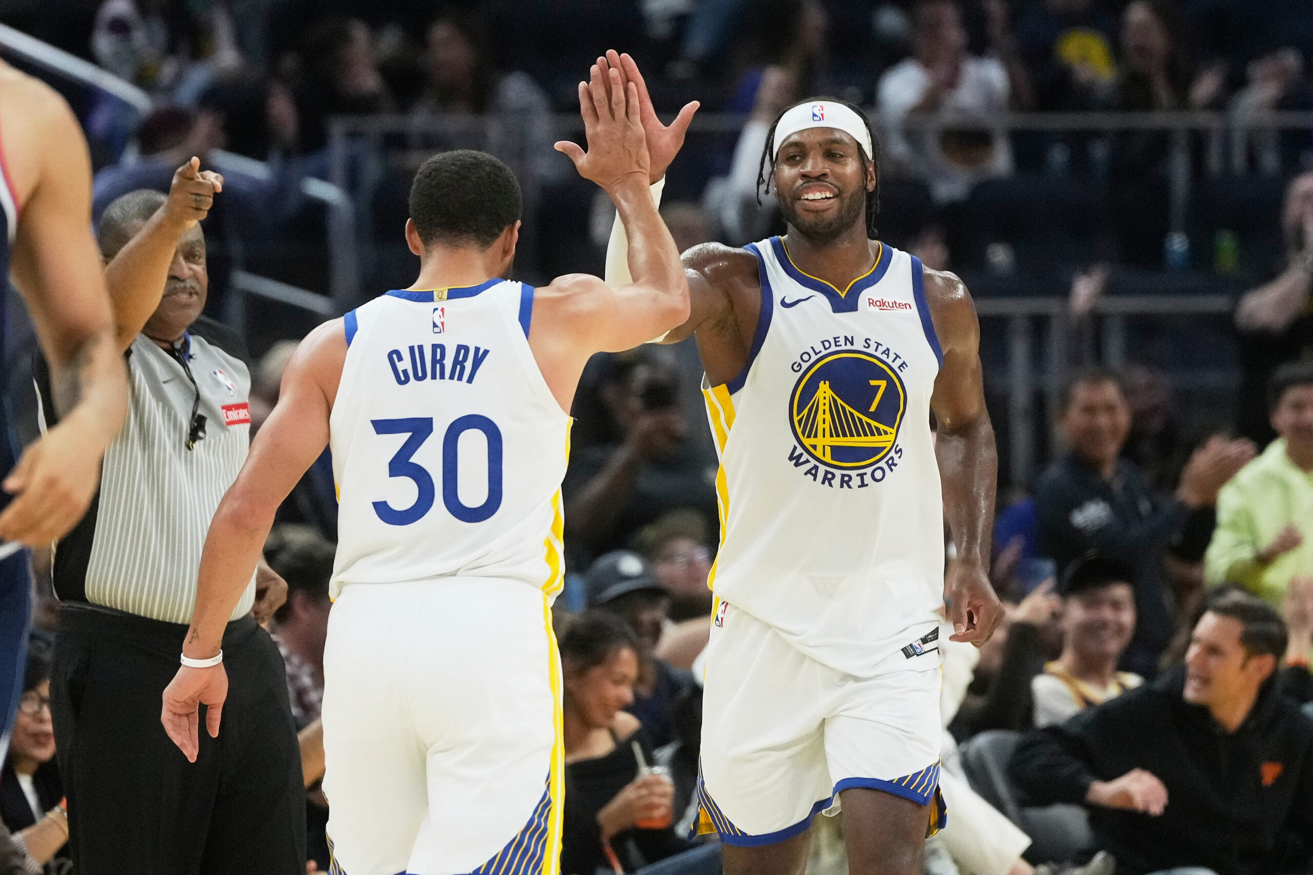 Golden State Warriors guard Buddy Hield, right, is congratulated by...