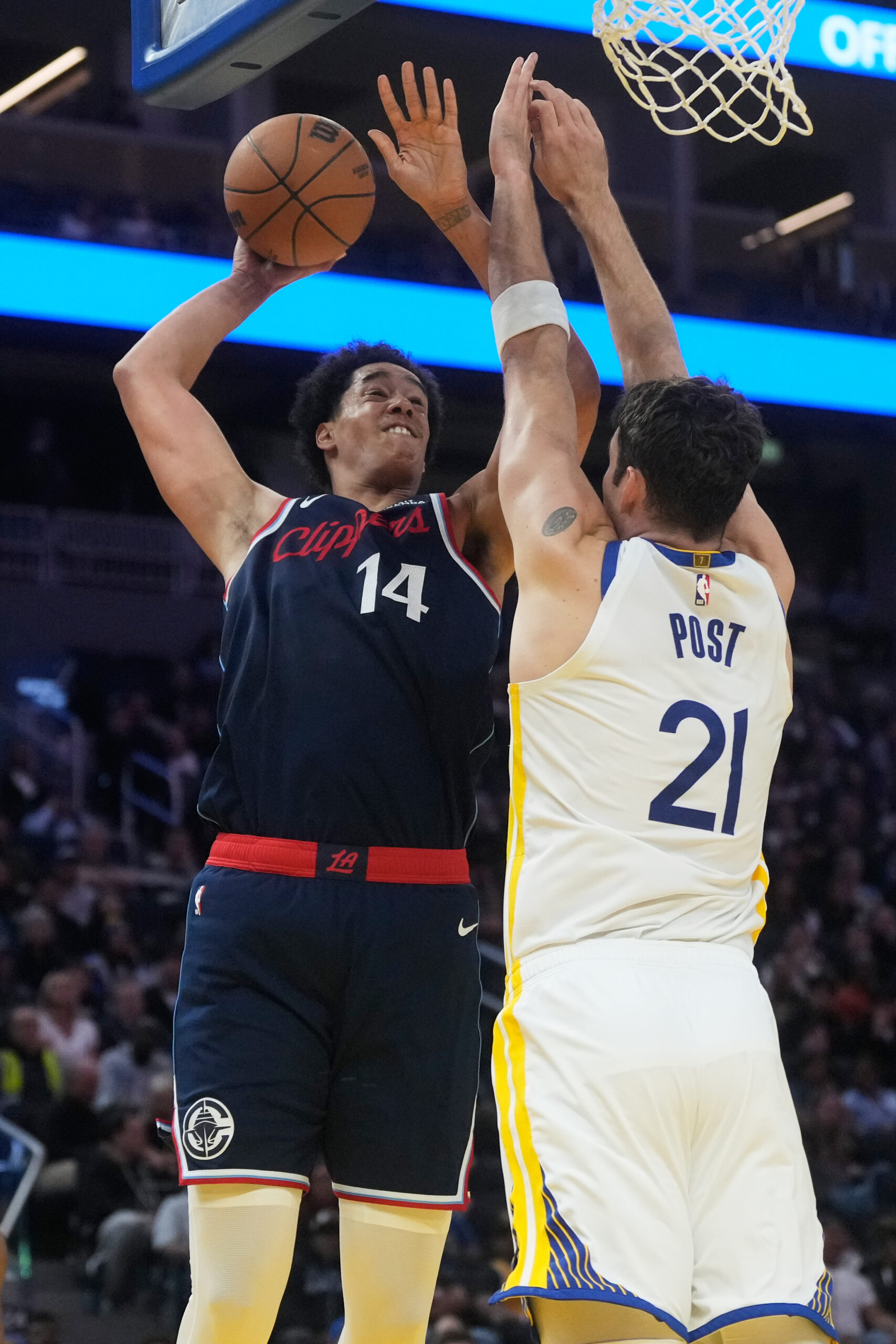 Clippers rookie center Yanic Konan Niederhauser, left, goes up to...