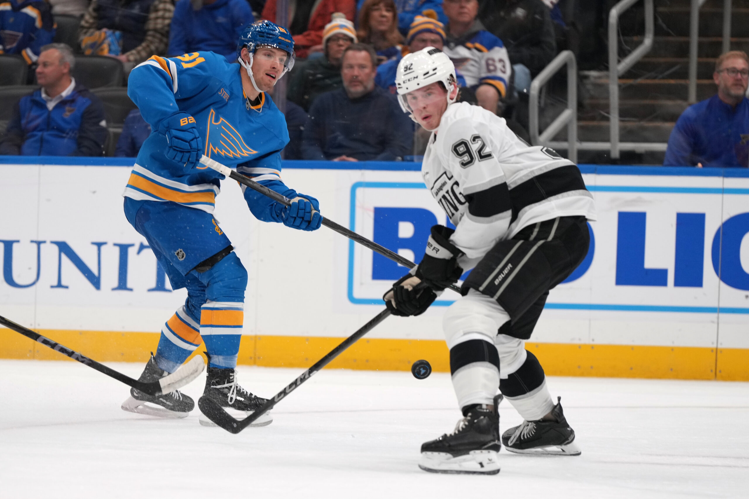 The St. Louis Blues’ Dylan Holloway (81) shoots past the...