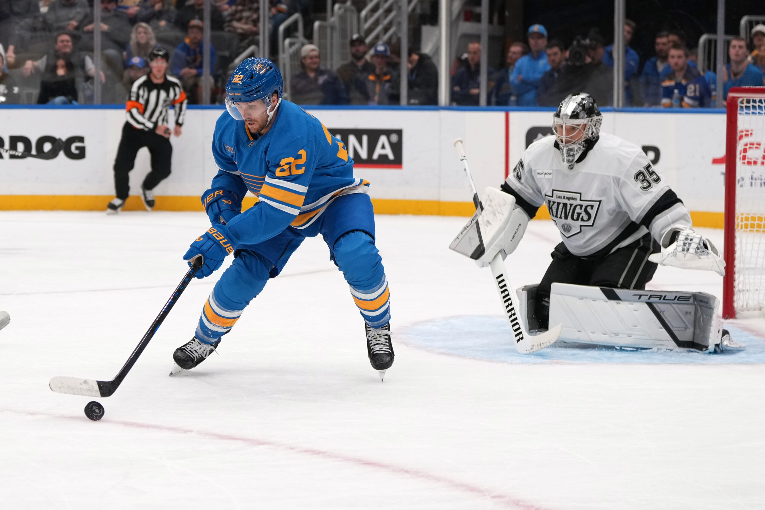 The St. Louis Blues’ Pius Suter, left, reaches for a...