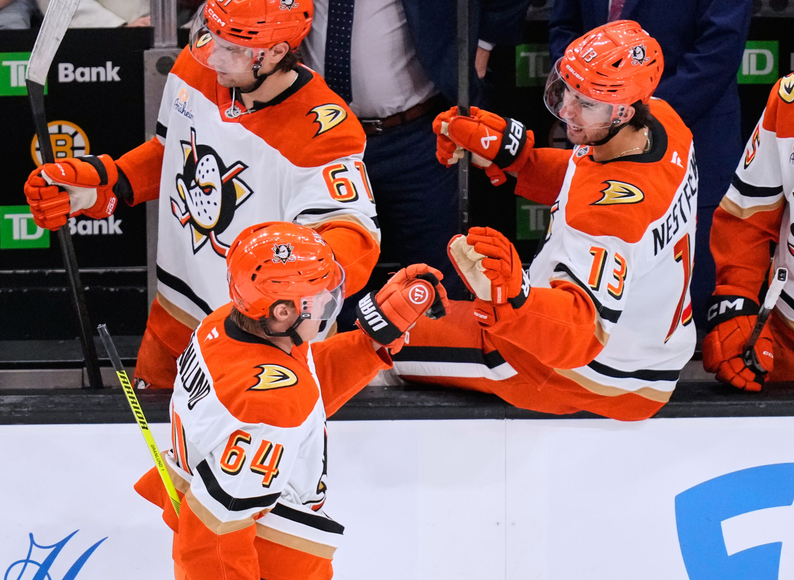 Ducks center Mikael Granlund (64) is congratulated after scoring a...