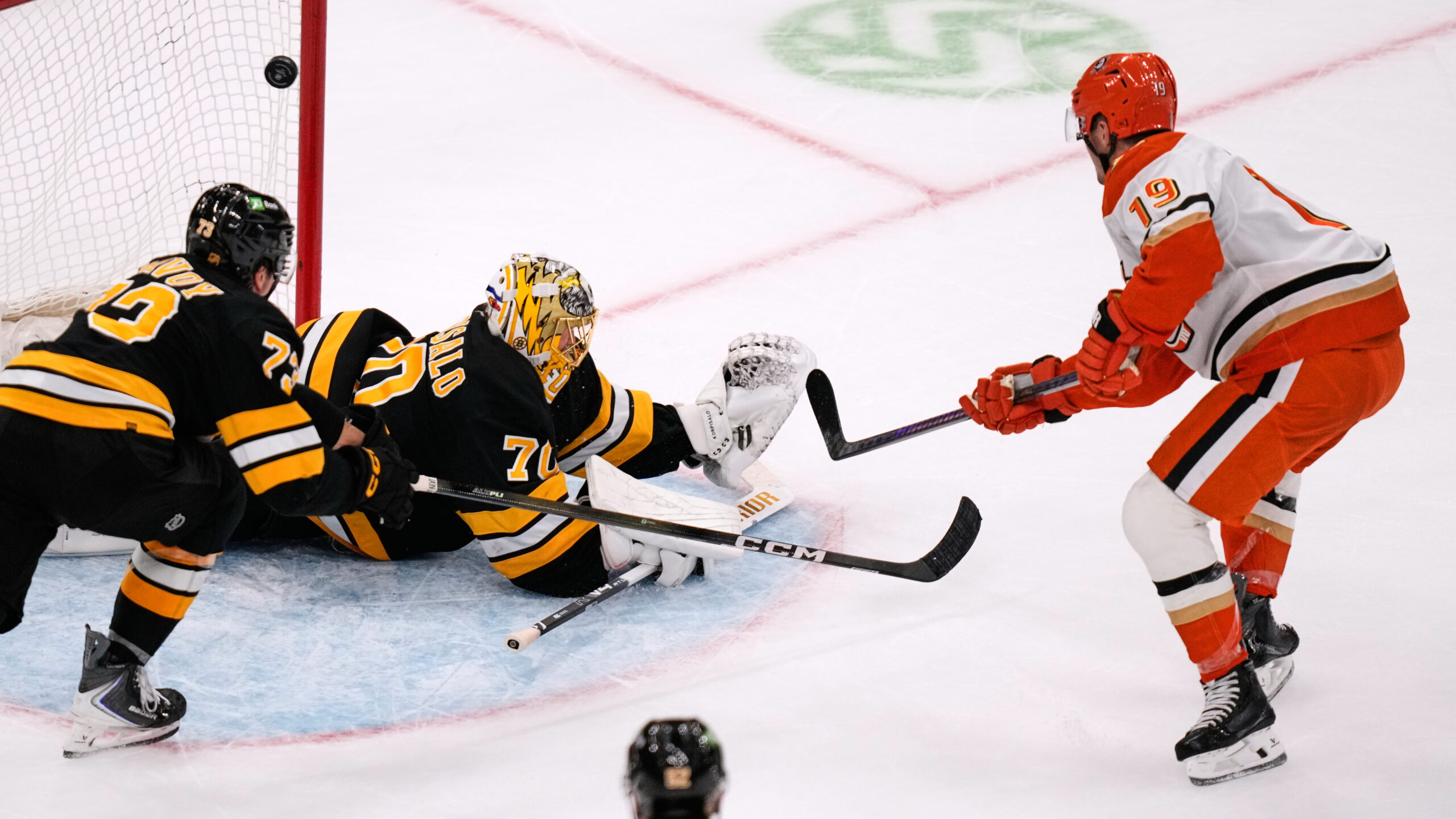 Ducks right wing Troy Terry, right, scores a tiebreaking goal...