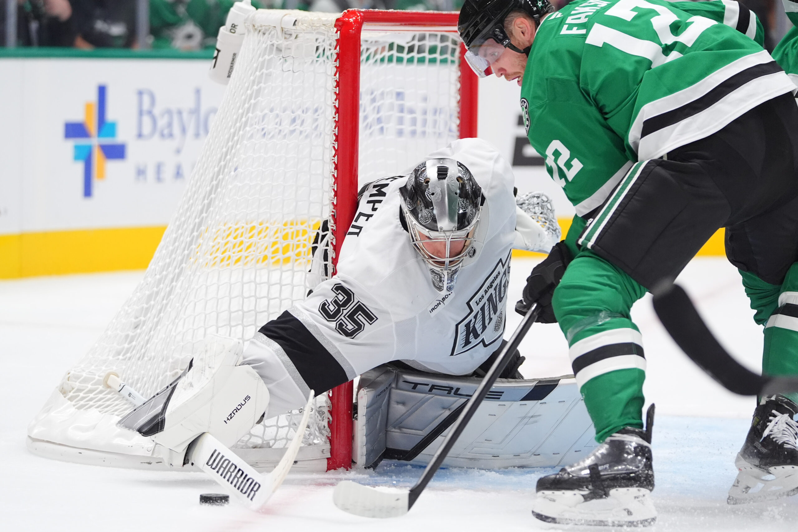 Kings goaltender Darcy Kuemper defends the goal against Dallas Stars...