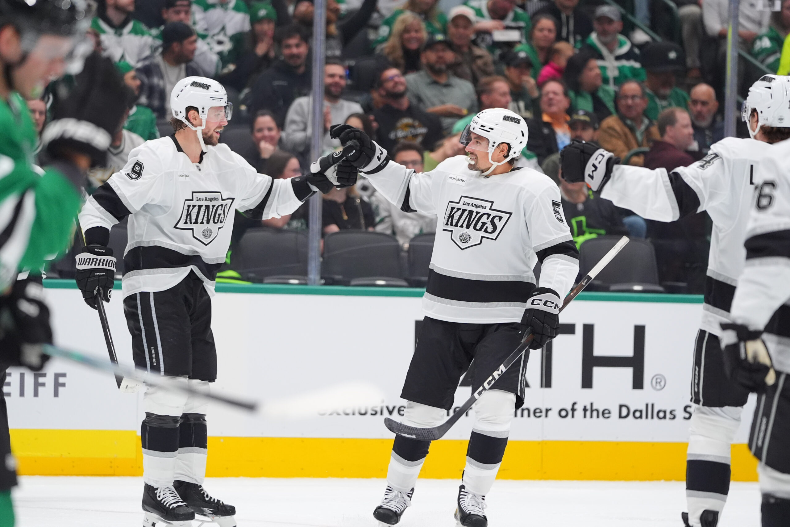 Kings defenseman Cody Ceci (5) celebrates with teammate right wing...