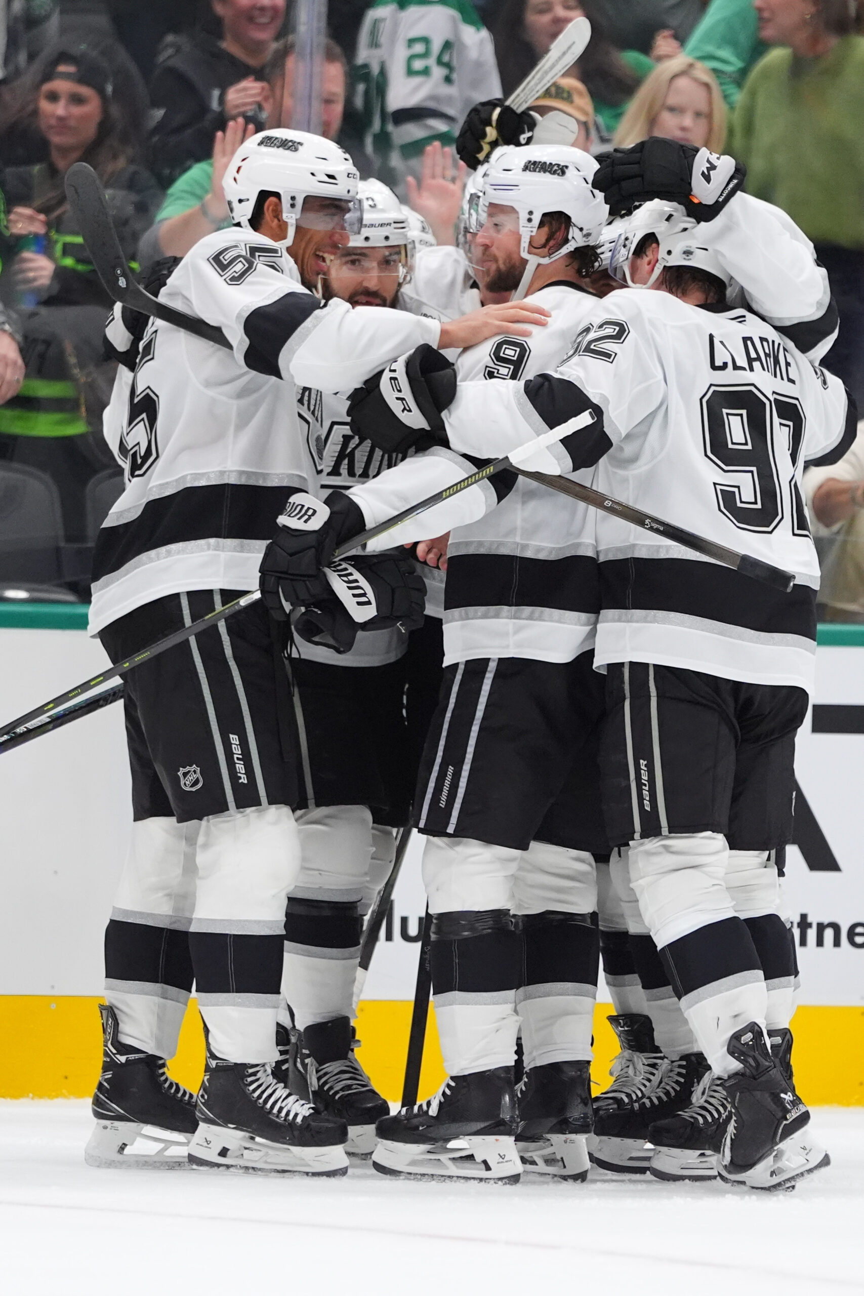 The Kings celebrate the game-winning goal by right wing Adrian...