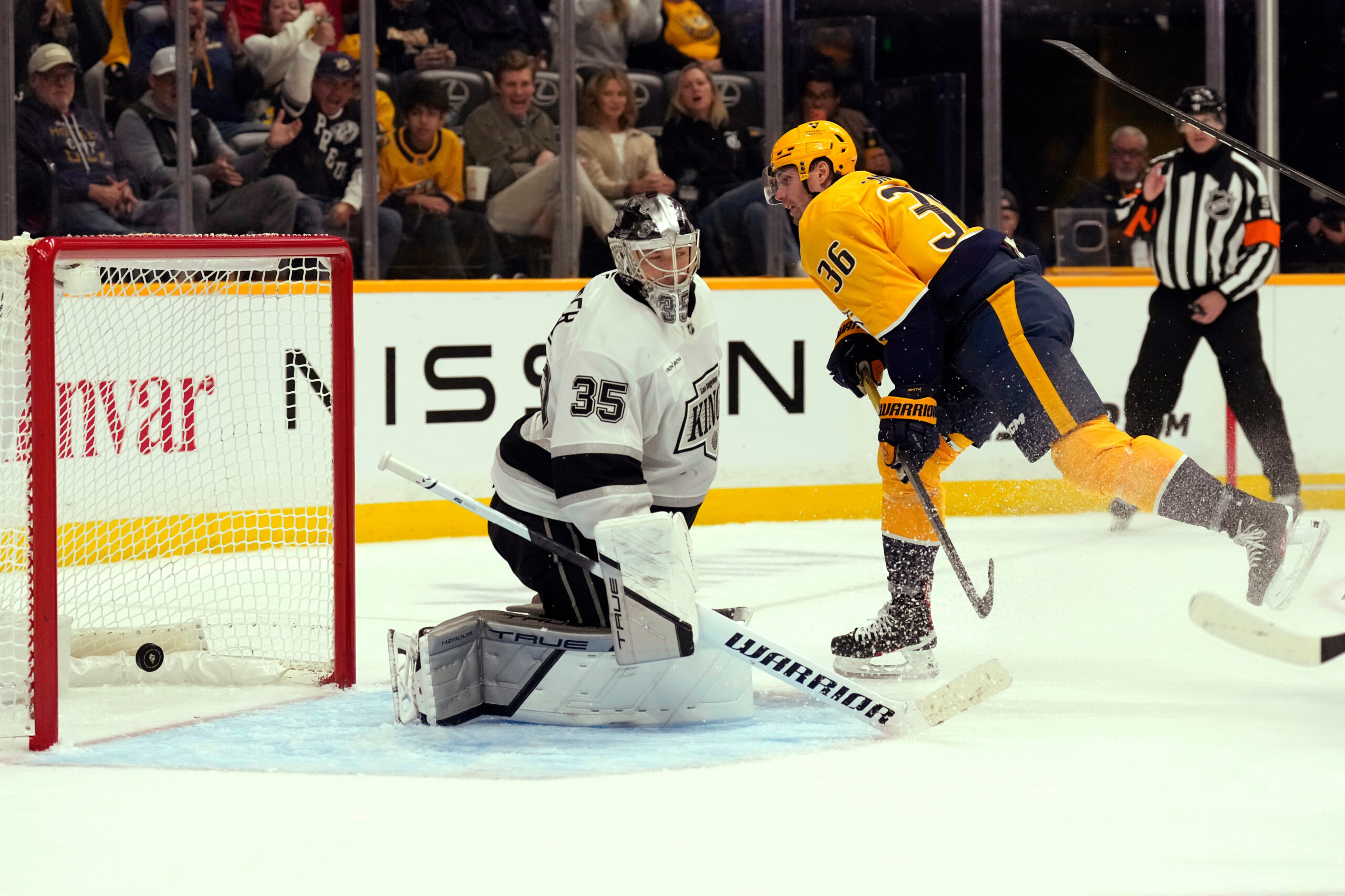 Nashville Predators left wing Cole Smith (36) scores a goal...