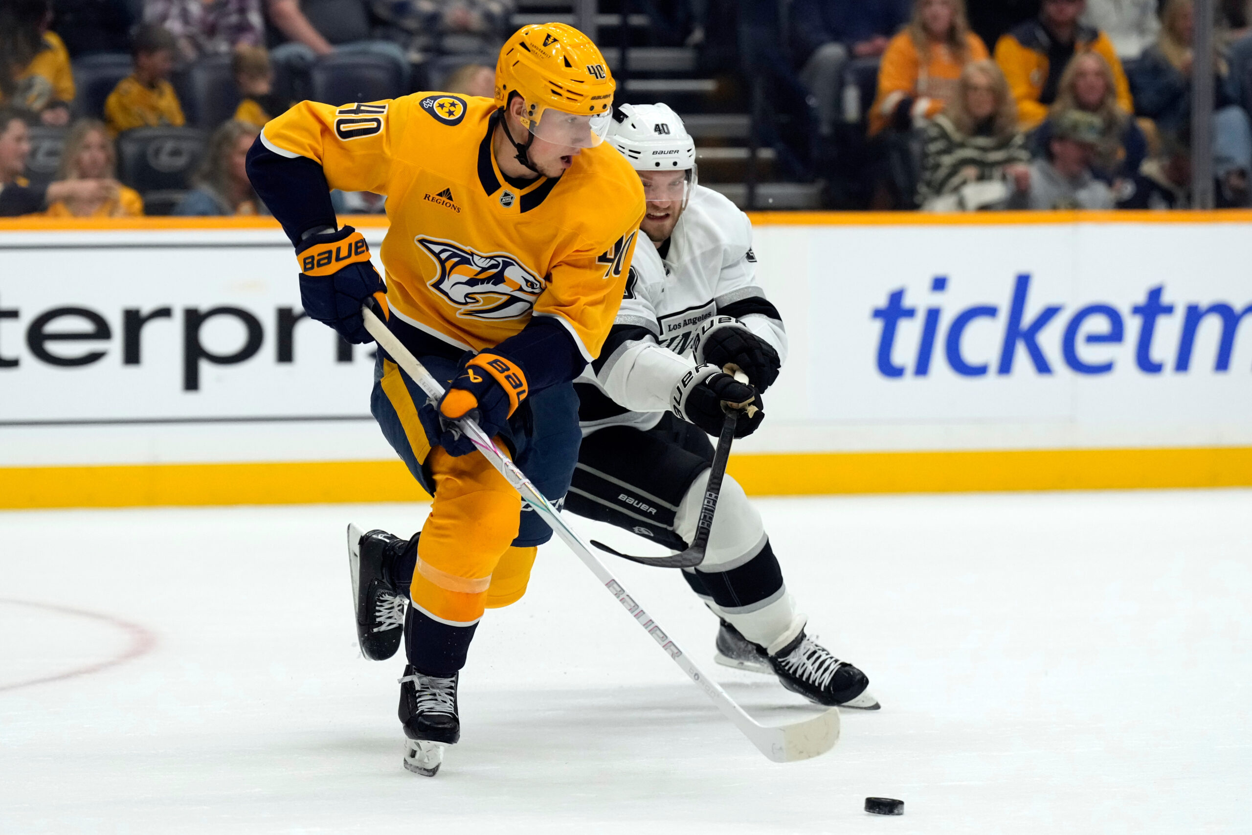 Nashville Predators center Fedor Svechkov, left, and Kings right wing...