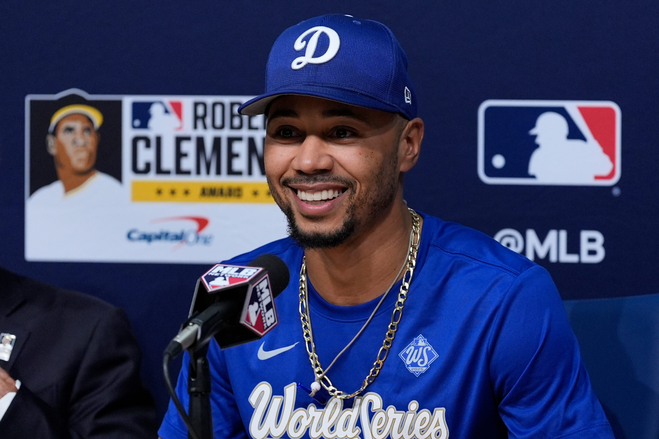 Dodgers shortstop Mookie Betts speaks to reporters after receiving the...
