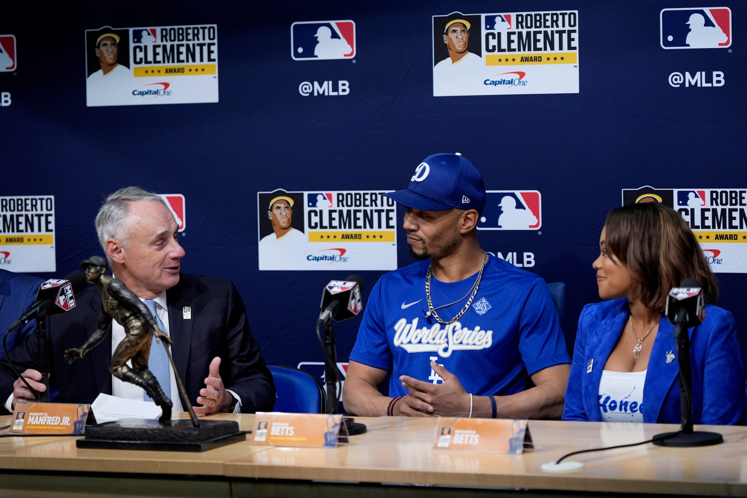 MLB commissioner Rob Manfred, left, speaks as Dodgers shortstop Mookie...