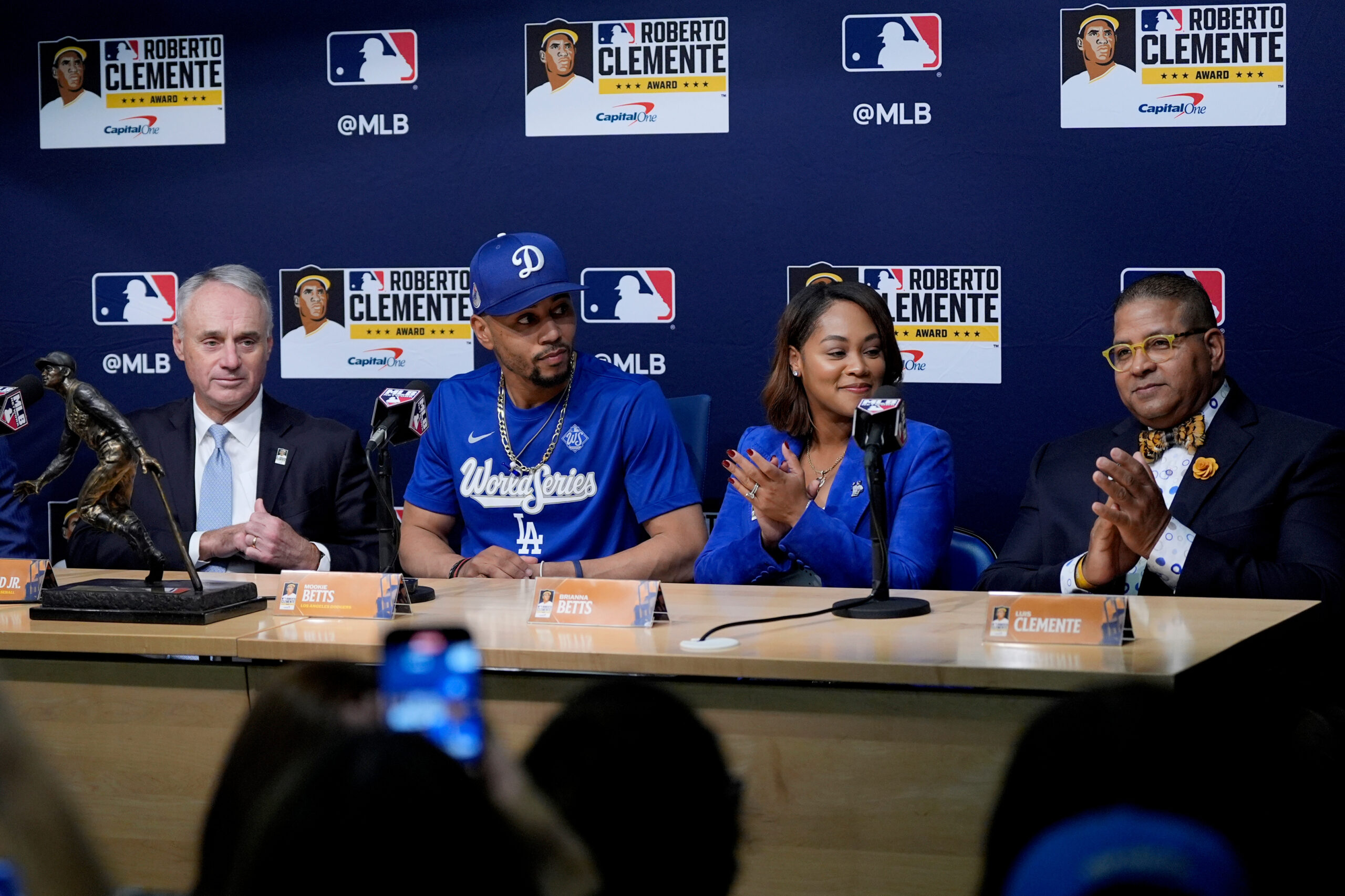 From left; MLB commissioner Rob Manfred, Dodgers shortstop Mookie Betts,...