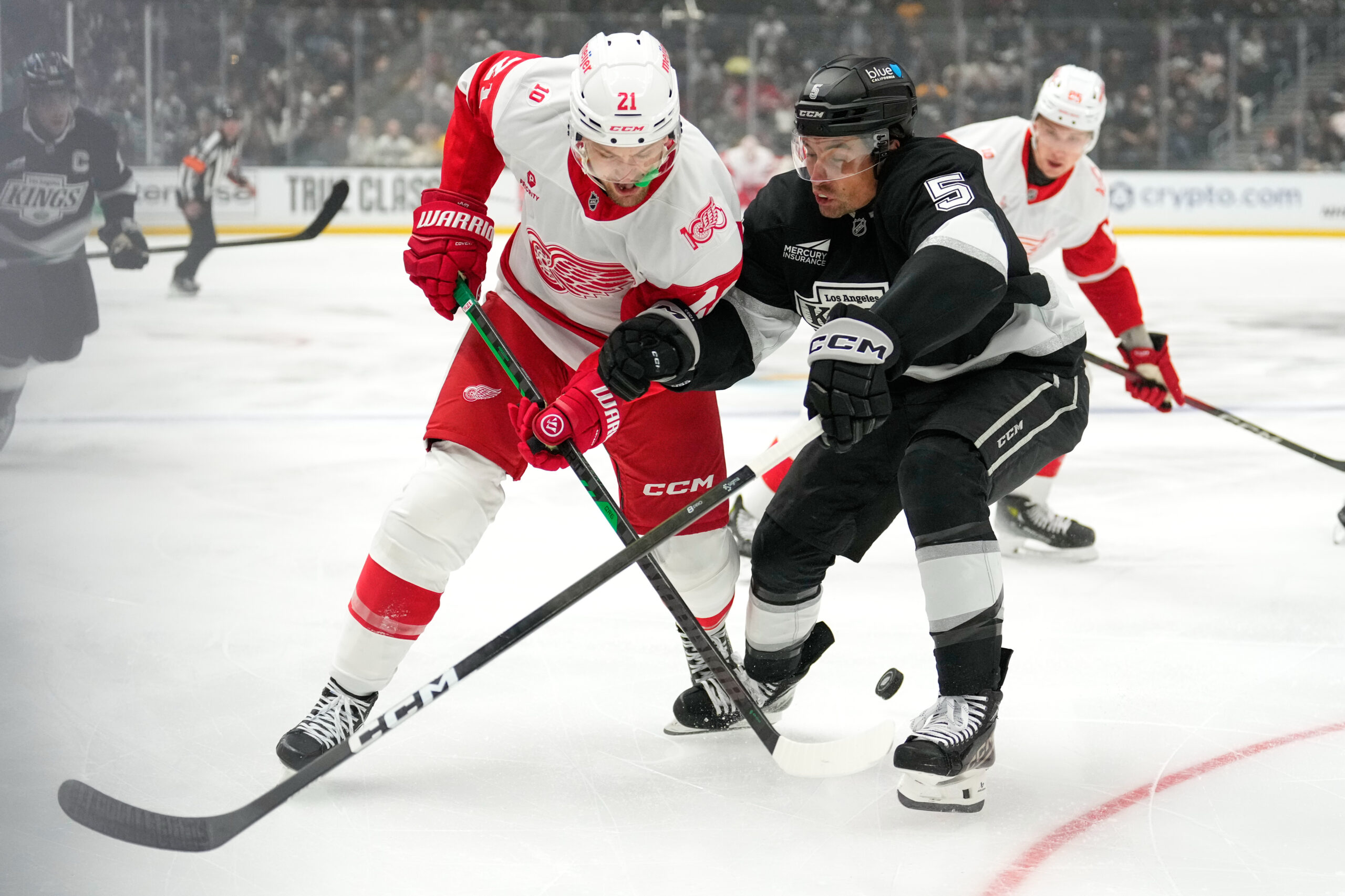 Detroit Red Wings left wing James van Riemsdyk, left, and...