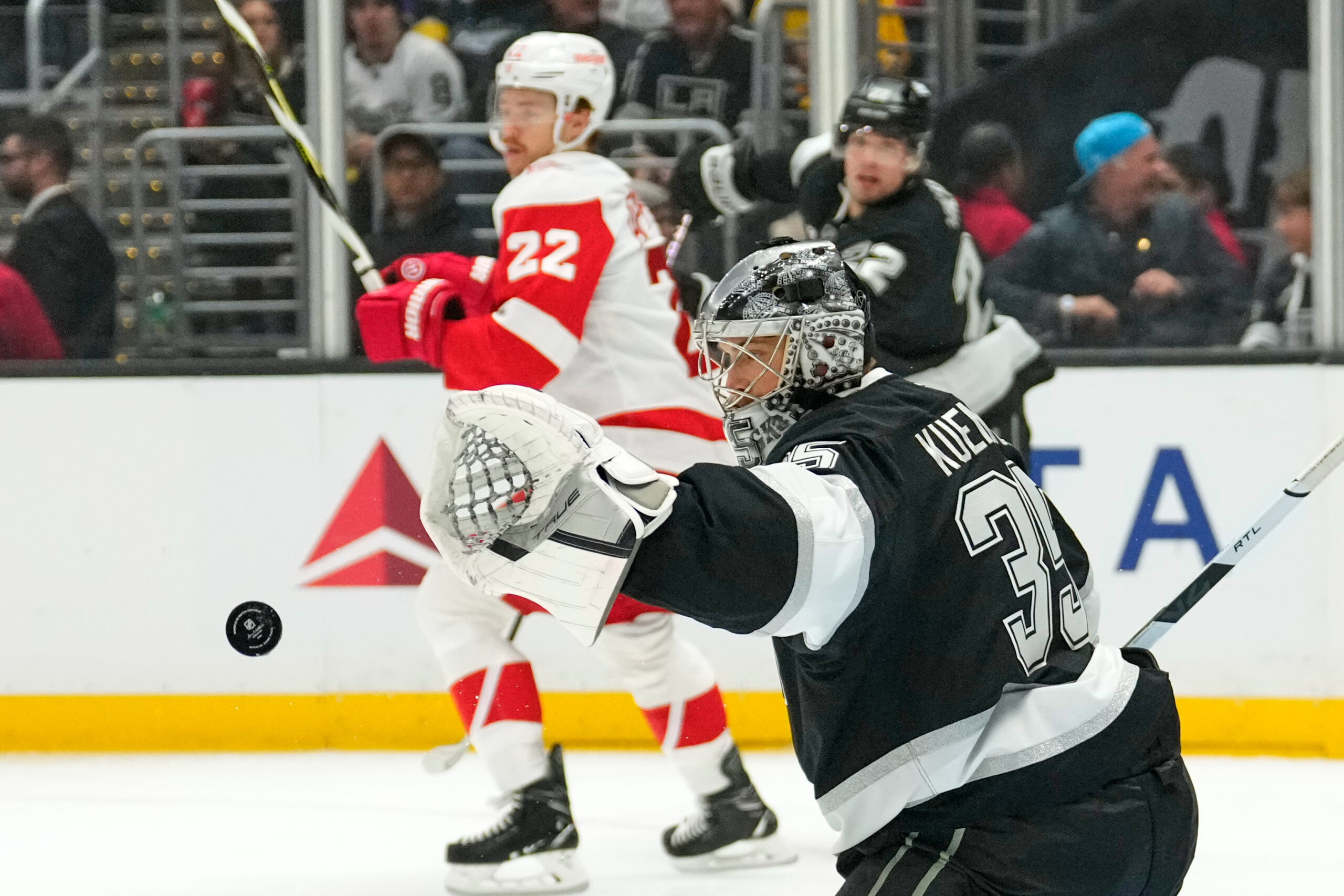 Kings goaltender Darcy Kuemper, right, deflects a shot as Detroit...