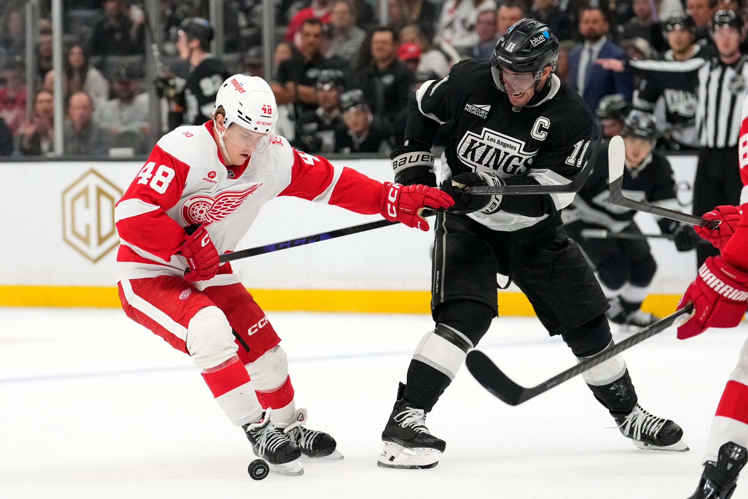 Detroit Red Wings right wing Jonatan Berggren, left, and Kings...