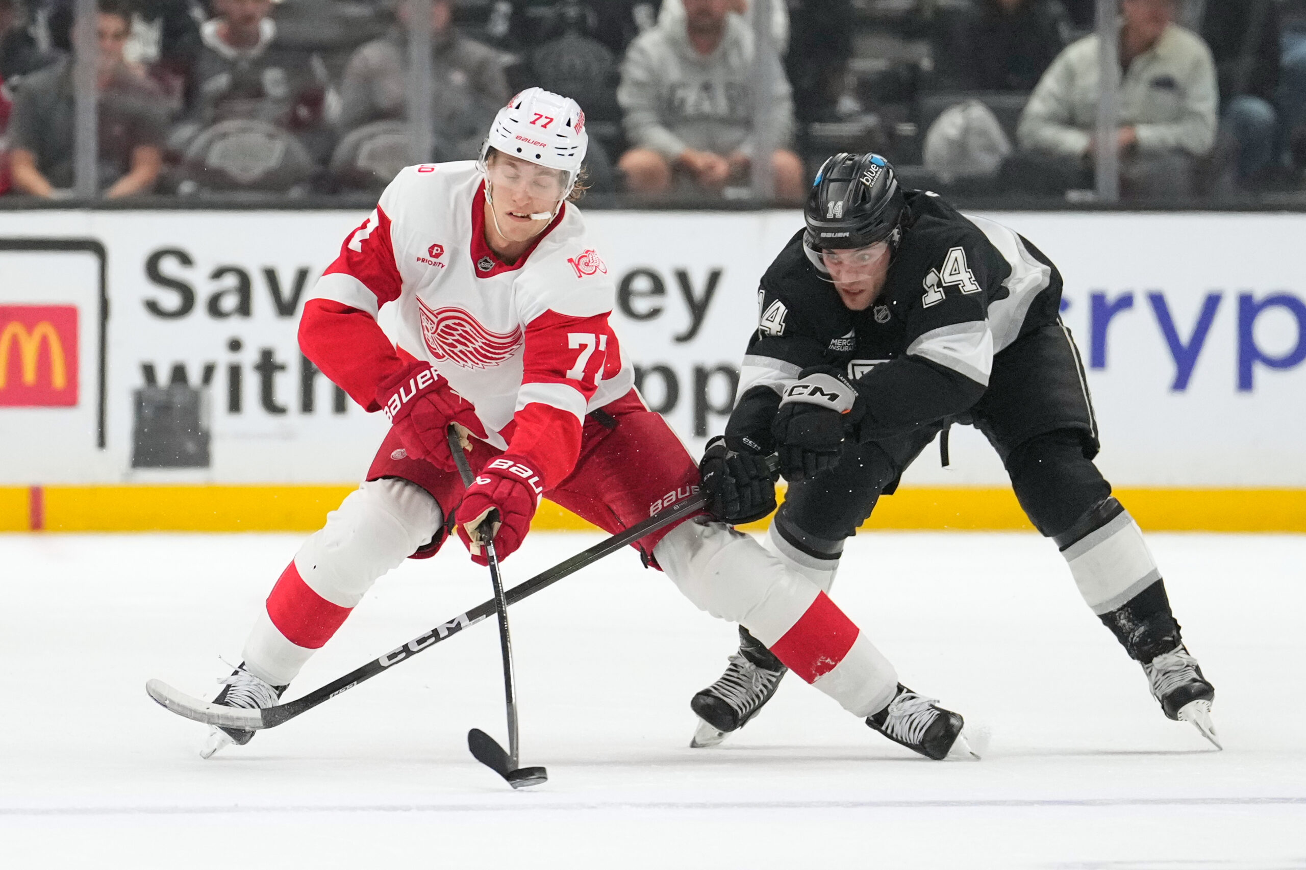 Detroit Red Wings defenseman Simon Edvinsson, left, and Kings right...