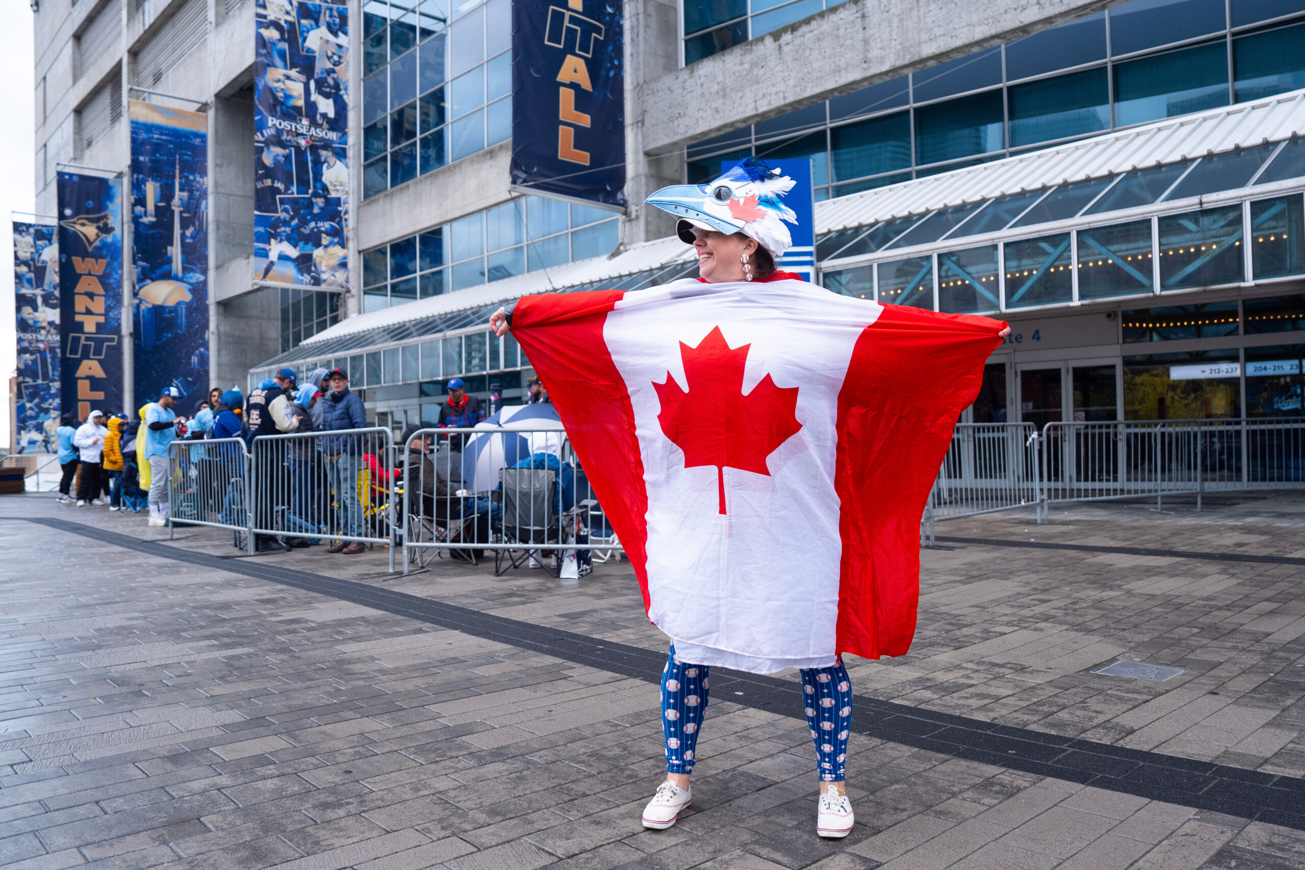 Toronto Blue Jays fan Kelly Wendt stands with a Canadian...