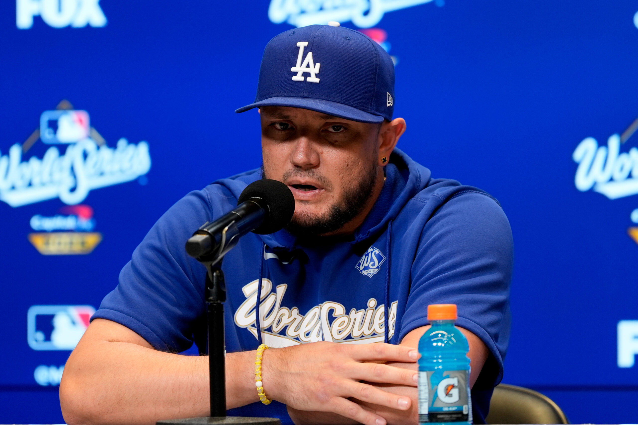 Dodgers infielder Miguel Rojas speaks to the media before Game...