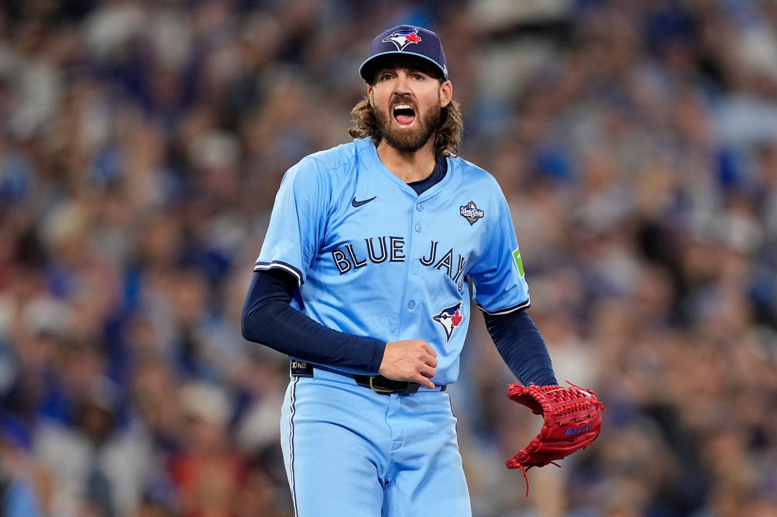 Toronto Blue Jays starting pitcher Kevin Gausman celebrates a strikeout...