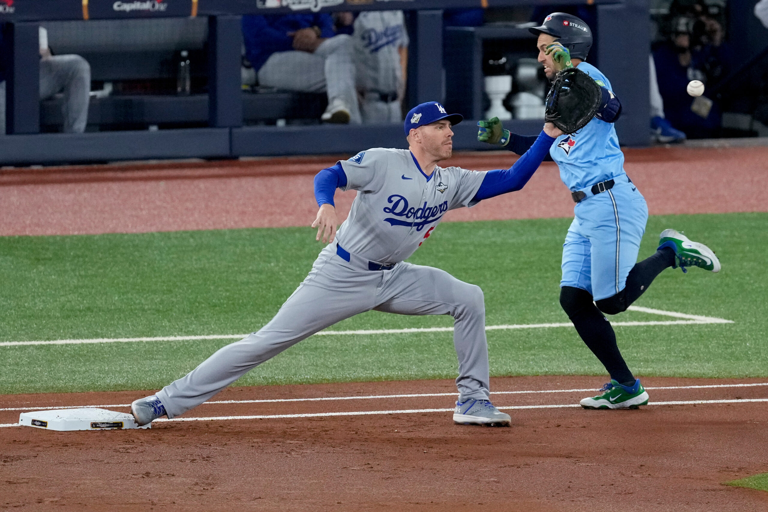 The Toronto Blue Jays’ George Springer, right, is thrown out...