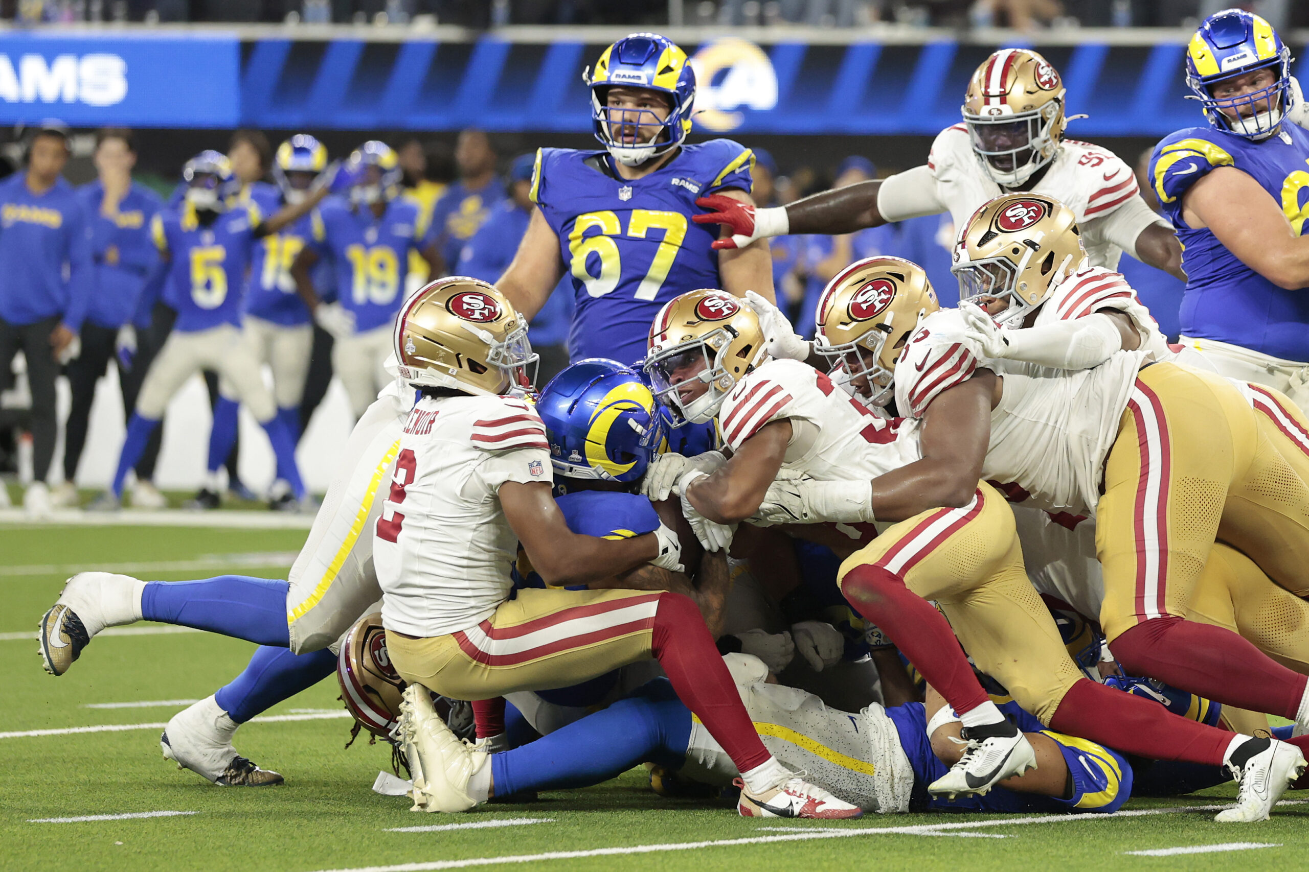 Rams running back Kyren Williams (23) is stopped short on...