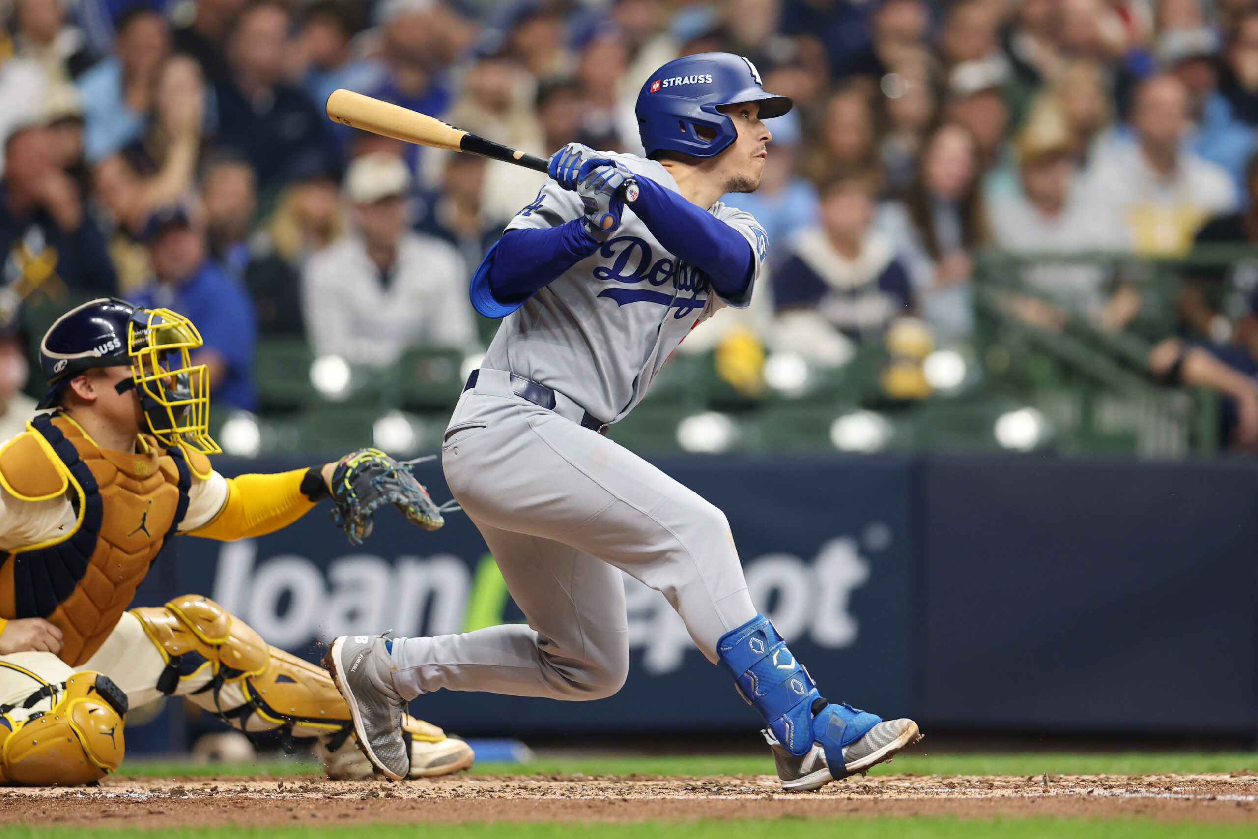 The Dodgers’ Tommy Edman hits a single during the fourth...