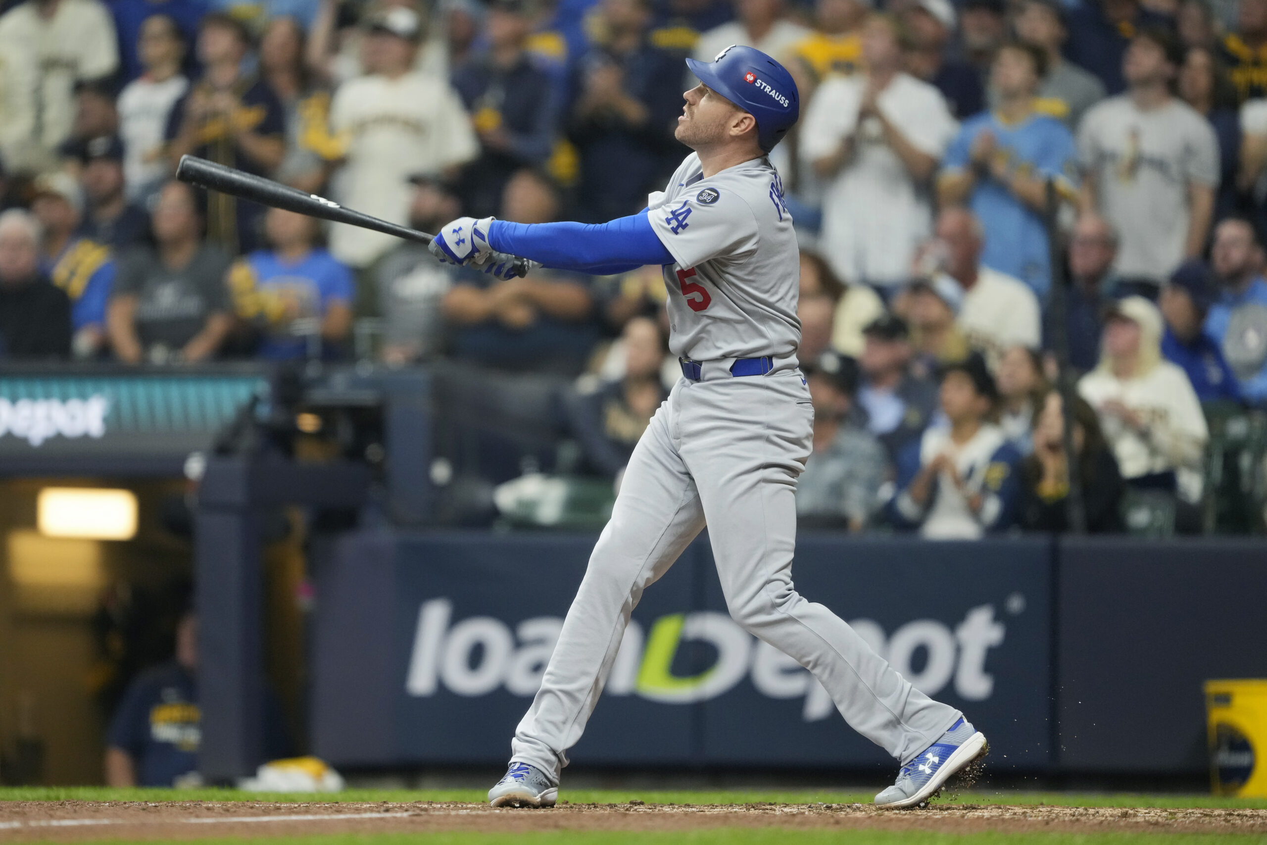 The Dodgers’ Freddie Freeman hits a solo home run during...