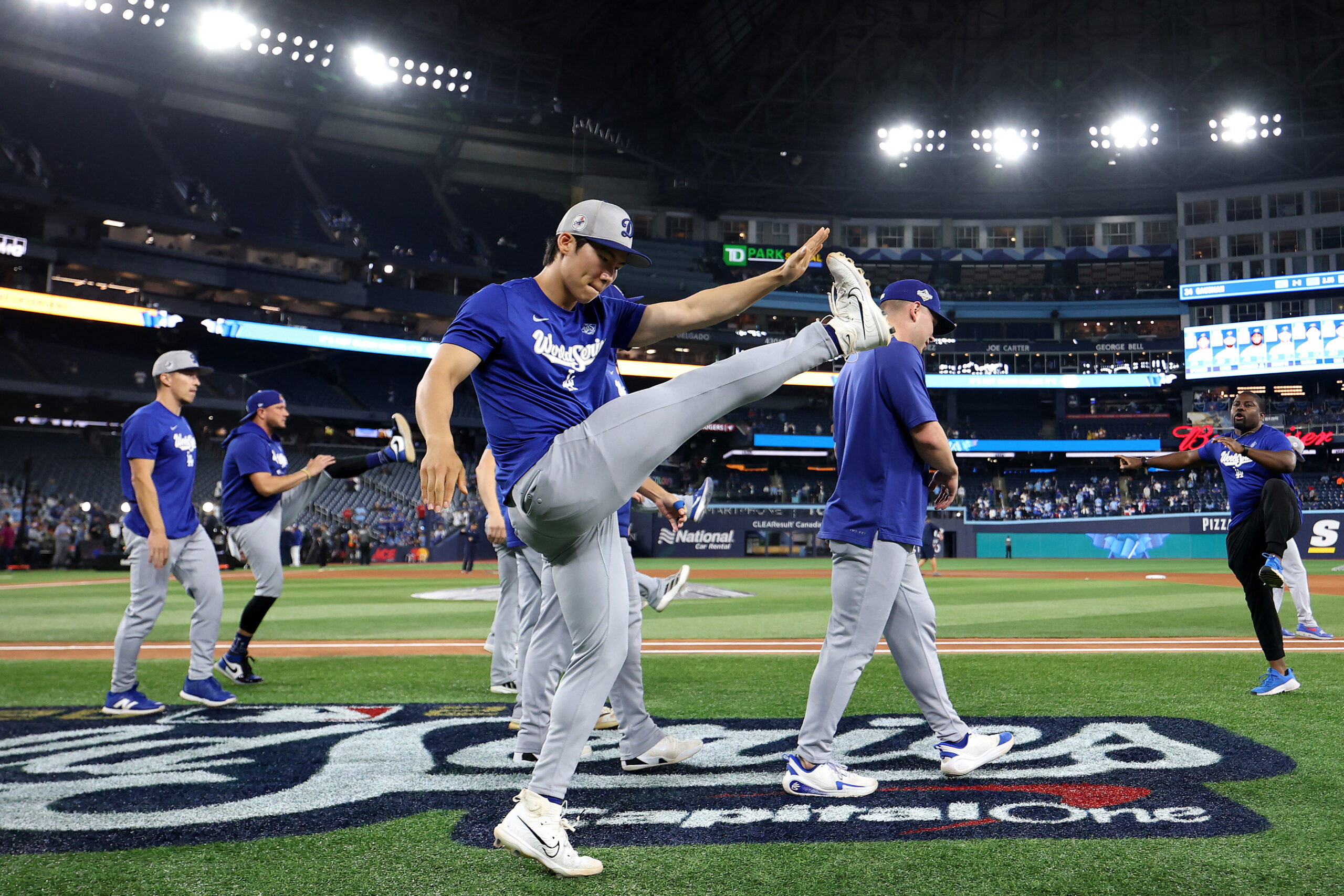 Dodgers utility player Hyeseong Kim warms up before Game 6...