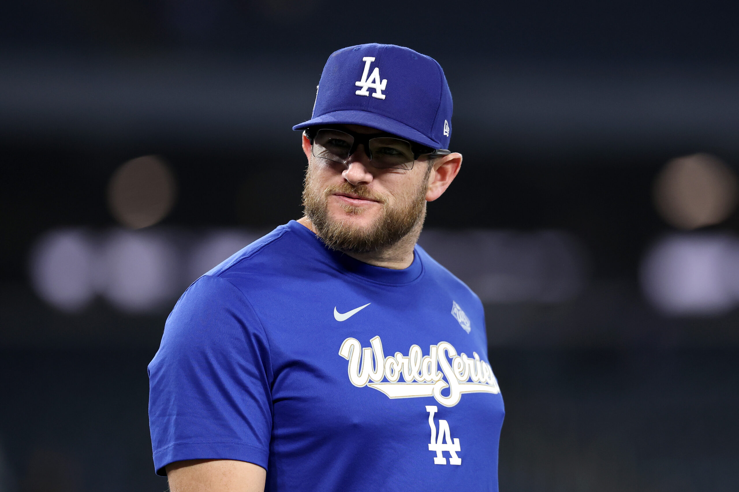 Dodgers third baseman Max Muncy looks on as the team...