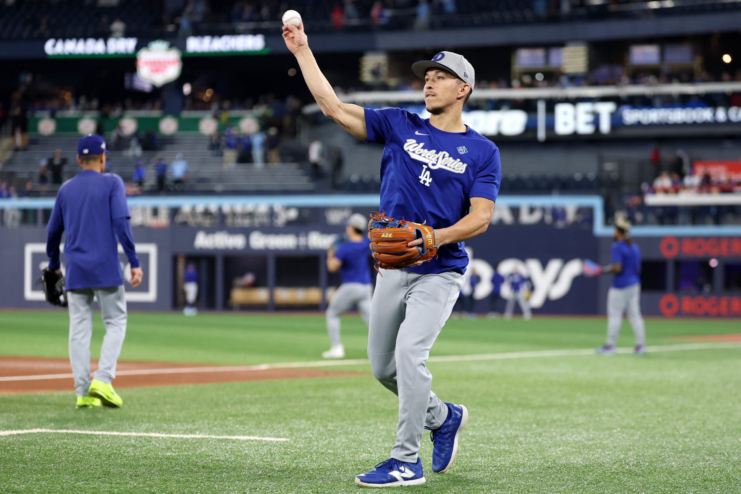 Dodgers infielder/outfielder Tommy Edman warms up before Game 6 of...