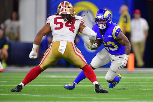 Oct 2, 2025; Inglewood, California, USA; Los Angeles Rams running back Kyren Williams (23) rushes the ball past San Francisco 49ers middle linebacker Fred Warner (54) during the second half at SoFi Stadium. Mandatory Credit: Gary A. Vasquez-Imagn Images Kyren Williams, Rams, 49ers