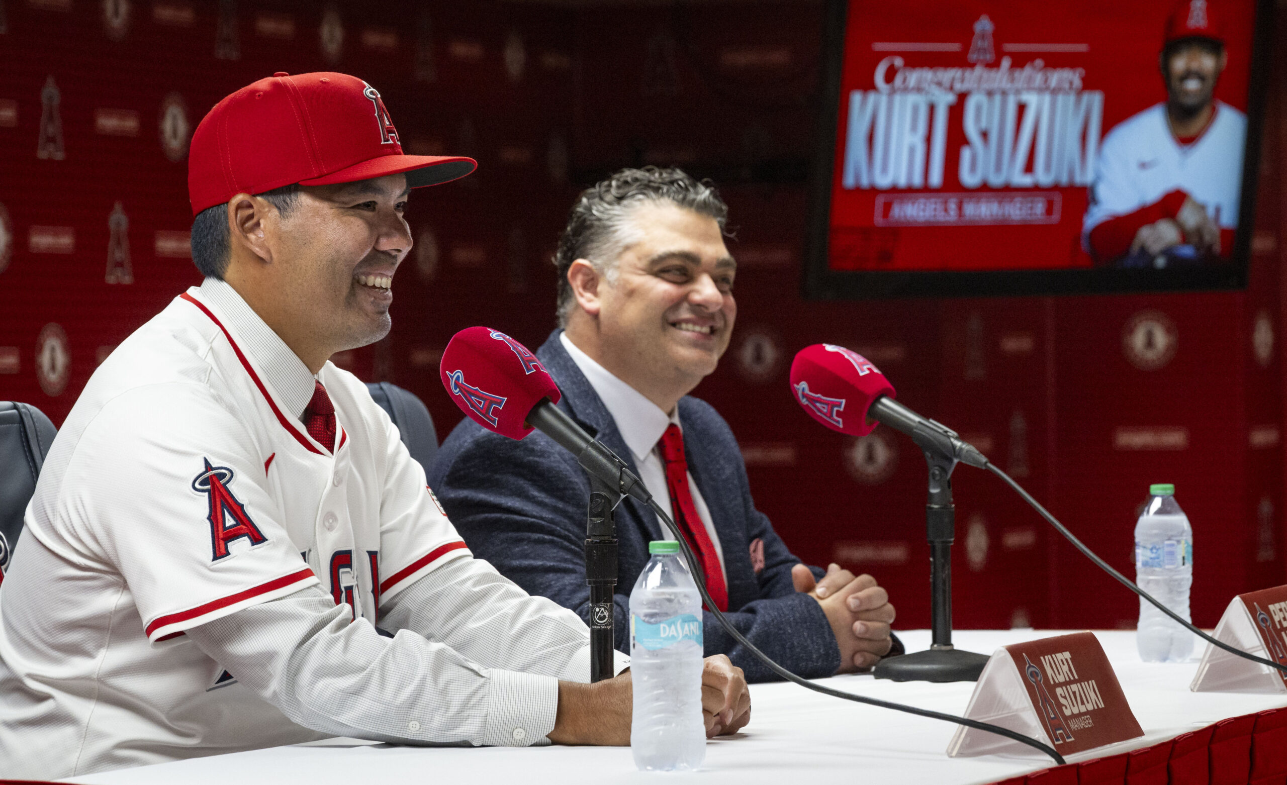 New Angels manager Kurt Suzuki, left, speaks to the media...