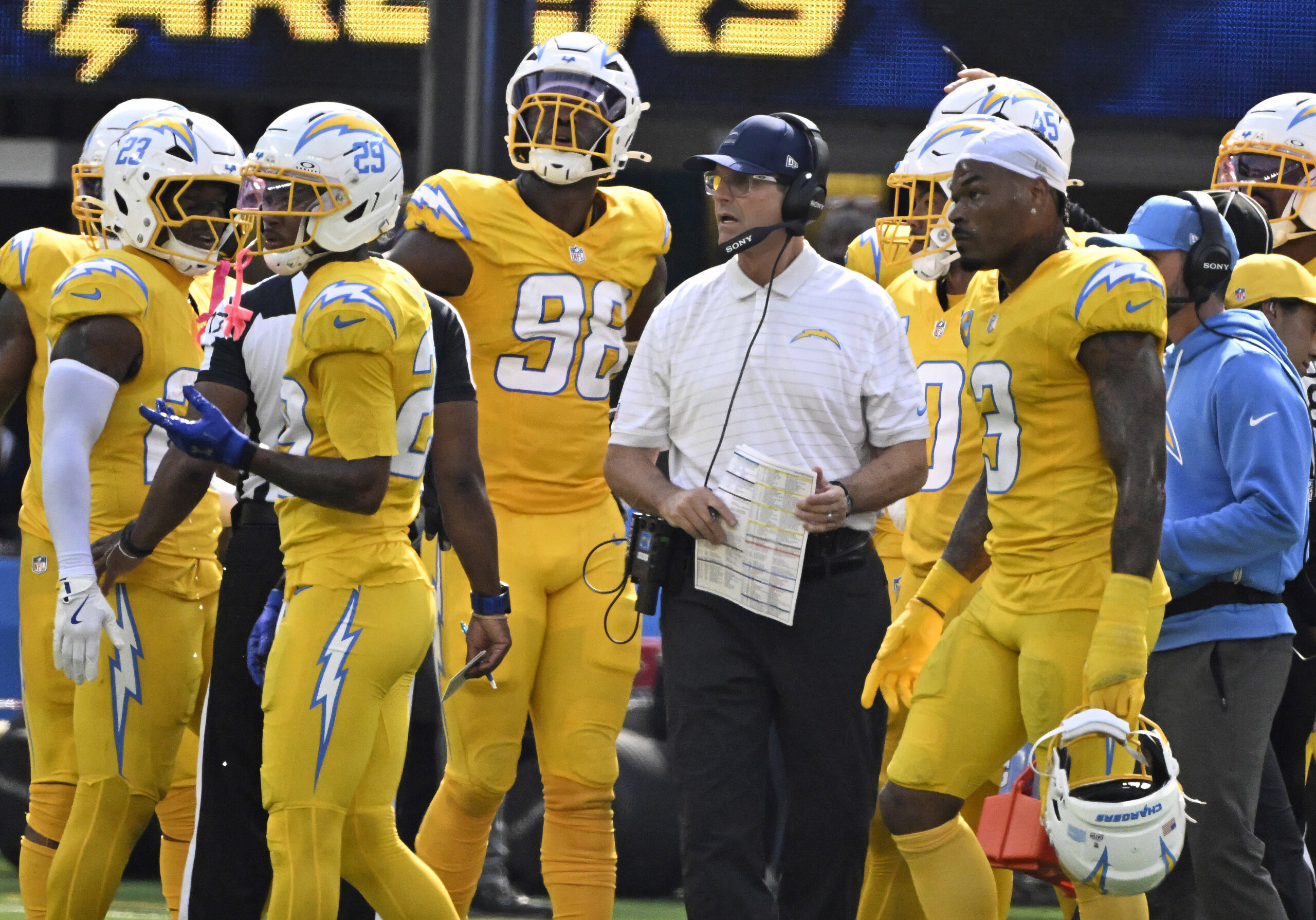 Head coach Jim Harbaugh of the Chargers looks on against...