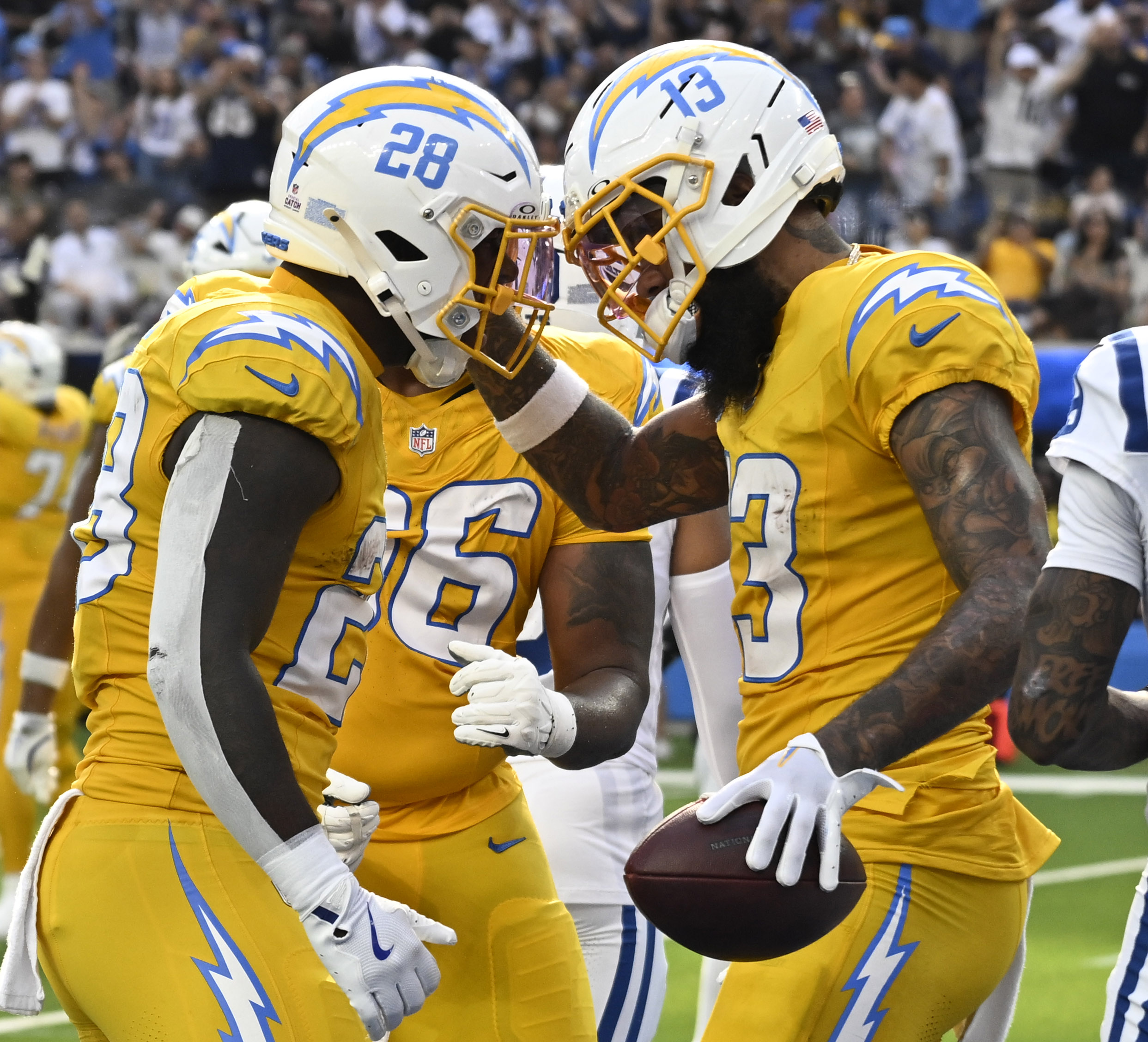 Wide receiver Keenan Allen #13 celebrates with teammate running back...