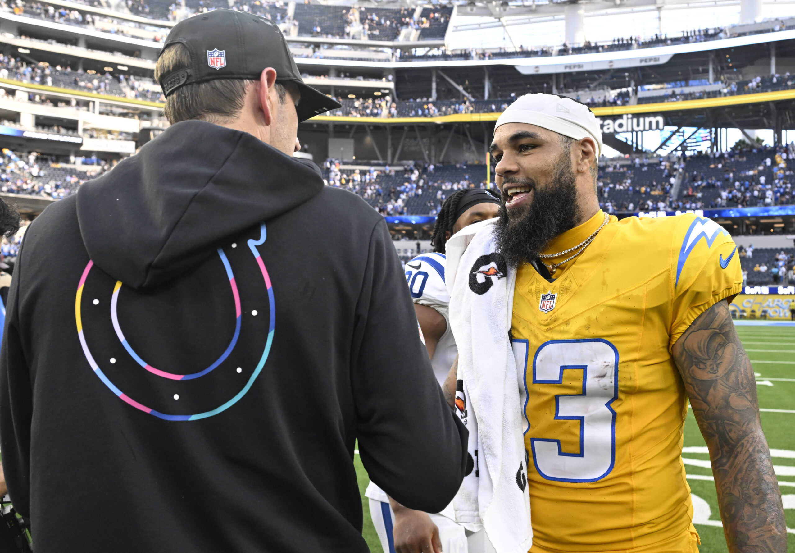 Wide receiver Keenan Allen #13 of the Chargers talks with...