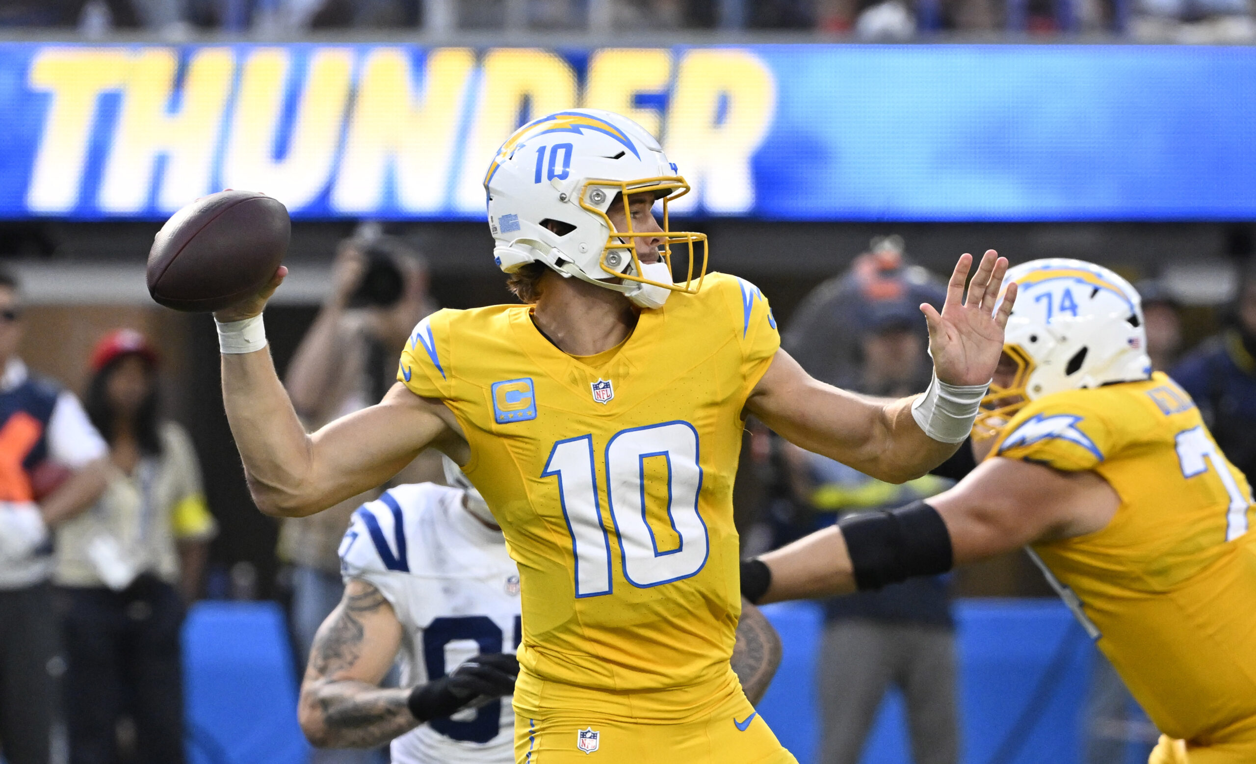 Quarterback Justin Herbert #10 of the Chargers passes against the...