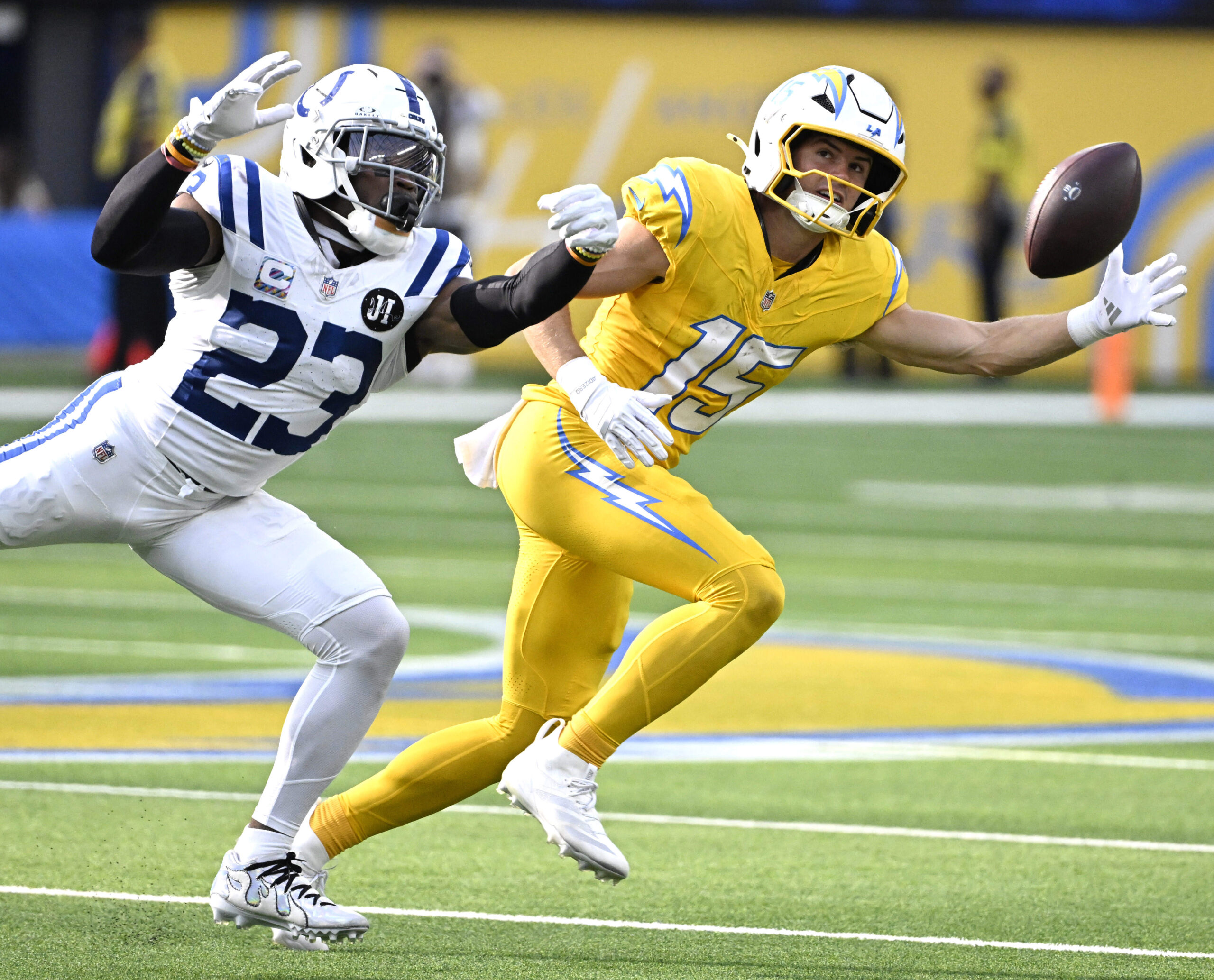 Wide receiver Ladd McConkey #15 of the Chargers can’t reach...