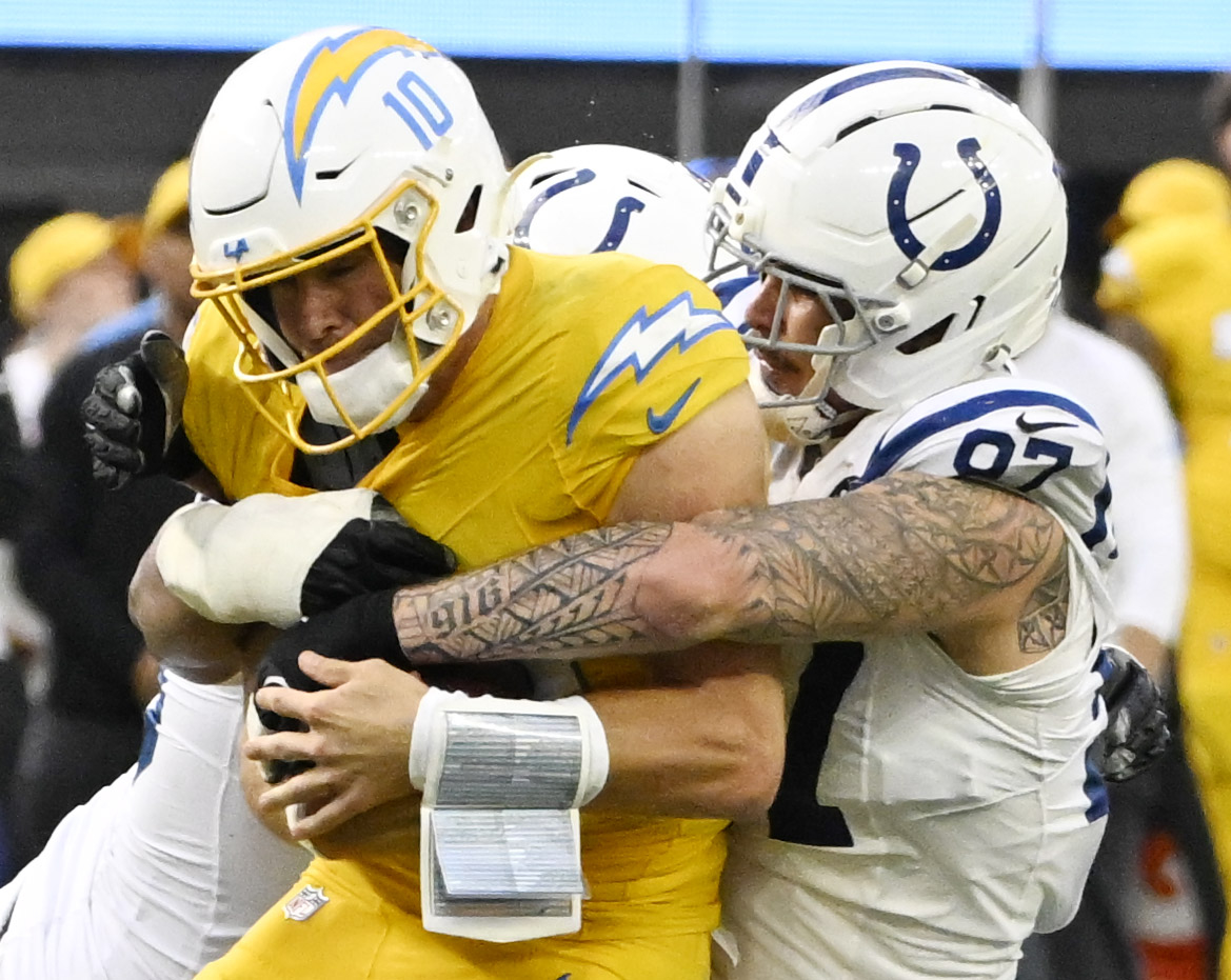 Defensive end Laiatu Latu #97 of the Indianapolis Colts tackles...