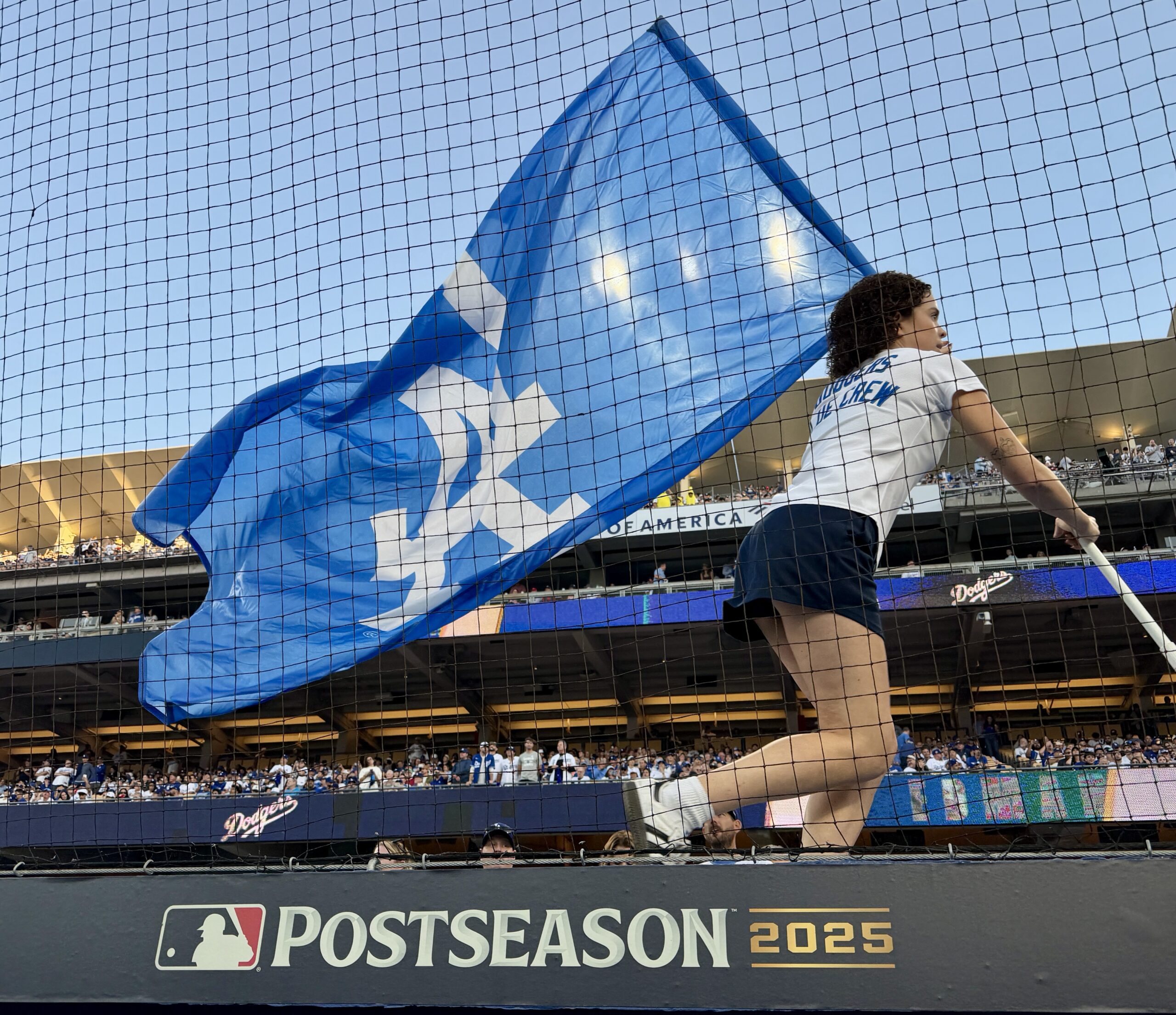 Fans cheer as the Dodger flag flies during the pregame...