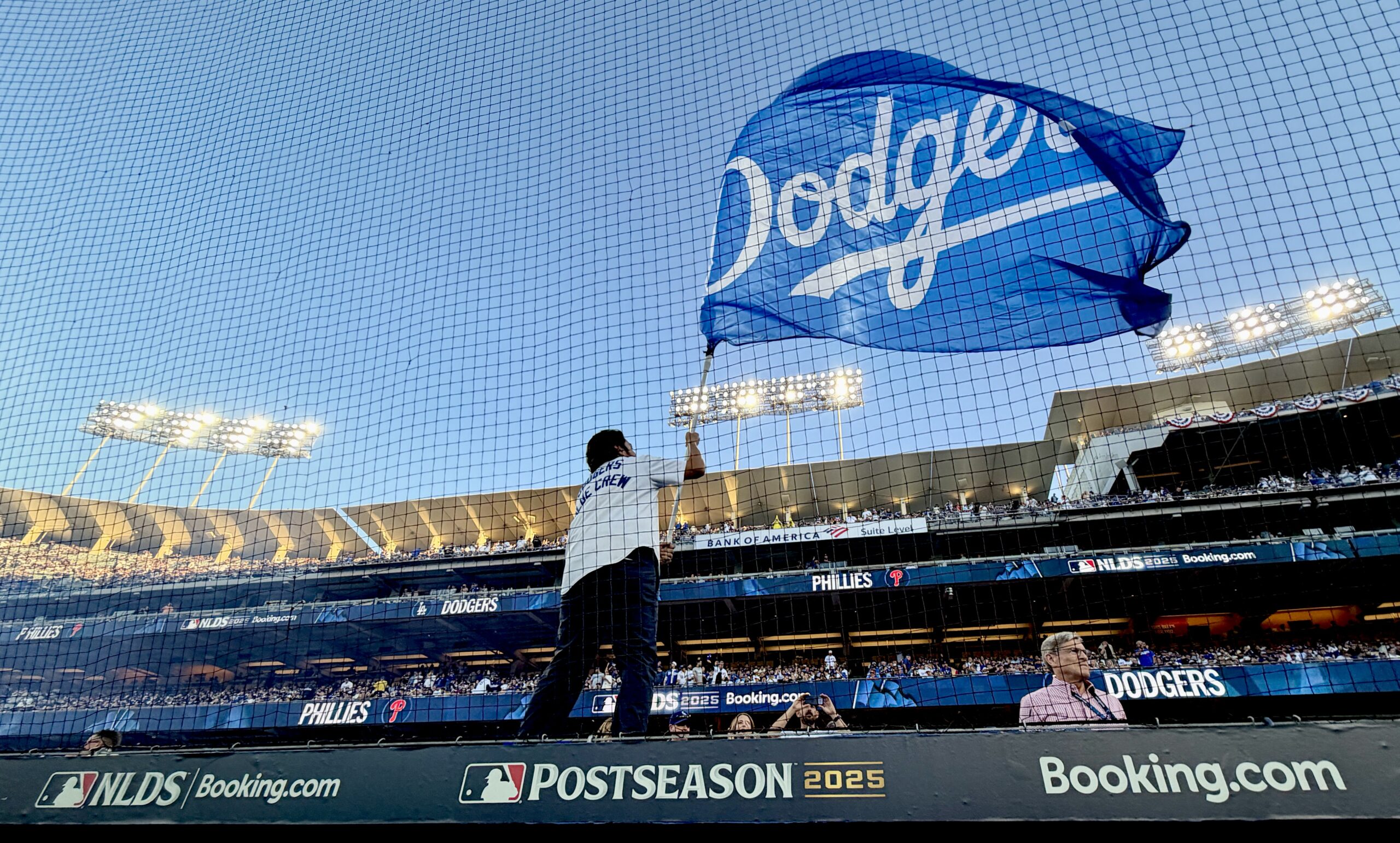 Fans cheer as the Dodger flag flies during the pregame...