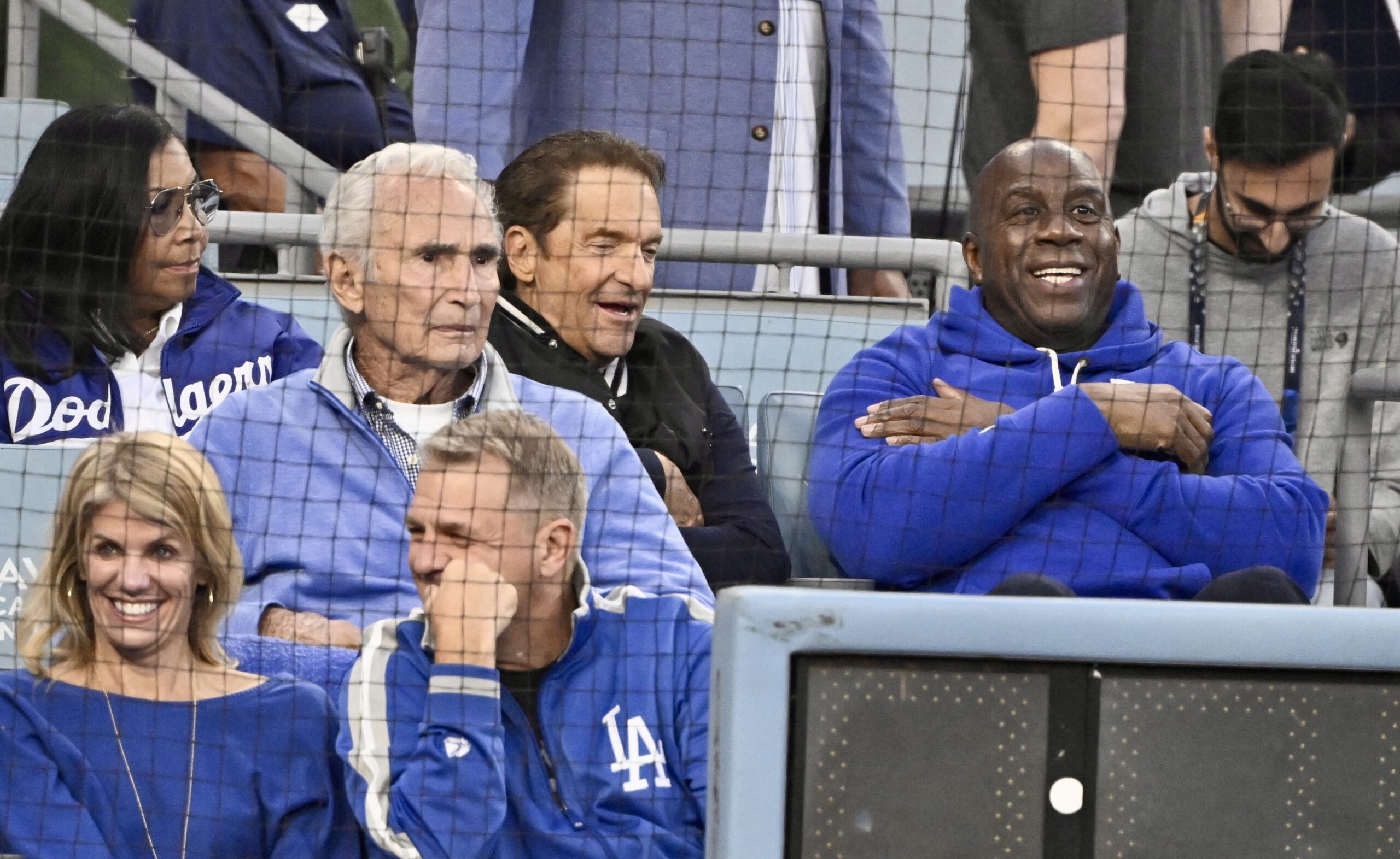 Dodgers legend Sandy Koufax, left, and Lakers legend Magic Johnson,...